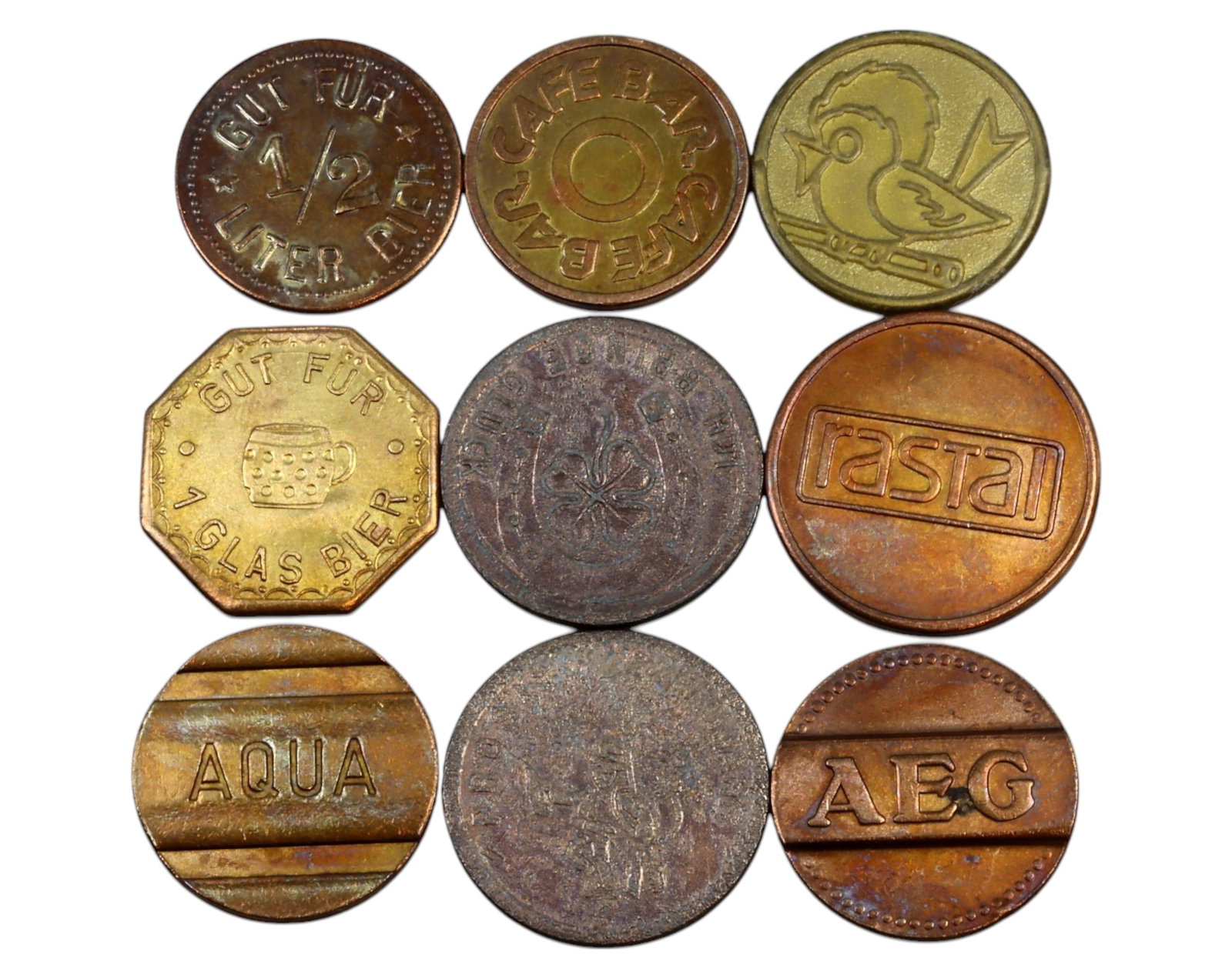 GERMANY: Mixed Trade, Bar & Utility Tokens - Brass & Copper, 20th Century (9 Pieces): A captivating collection of nine German tokens from the 20th century, struck in brass and copper, with diameters ranging from 20mm to 25mm and a total weight of 27g. This selection includes beer and c