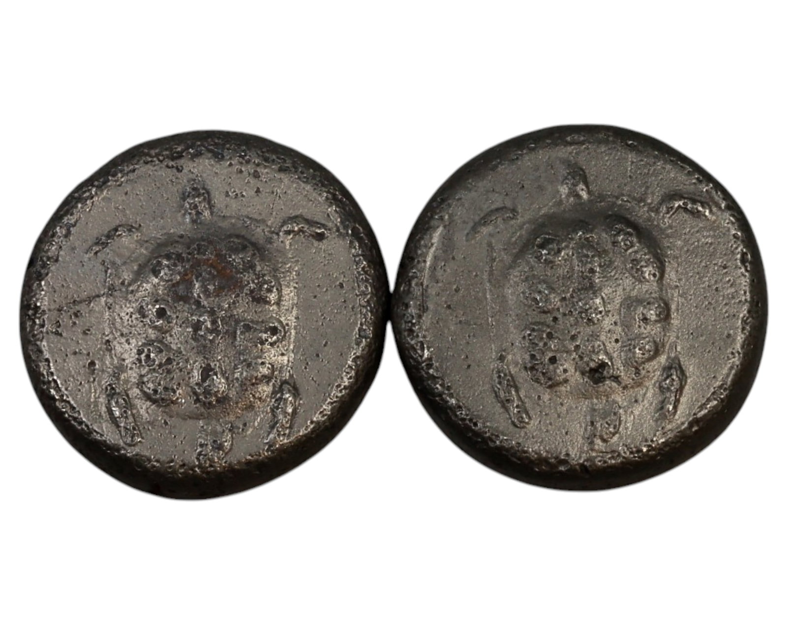 GREECE: Ancient Lead Tetradrachm-Style Tokens - 5th-4th Century BCE (Lot of 2): A fascinating pair of ancient lead tokens, each measuring 27mm in diameter and collectively weighing 44g. These pieces exhibit the iconic Aegina-style tortoise on the obverse, a well-known motif from 