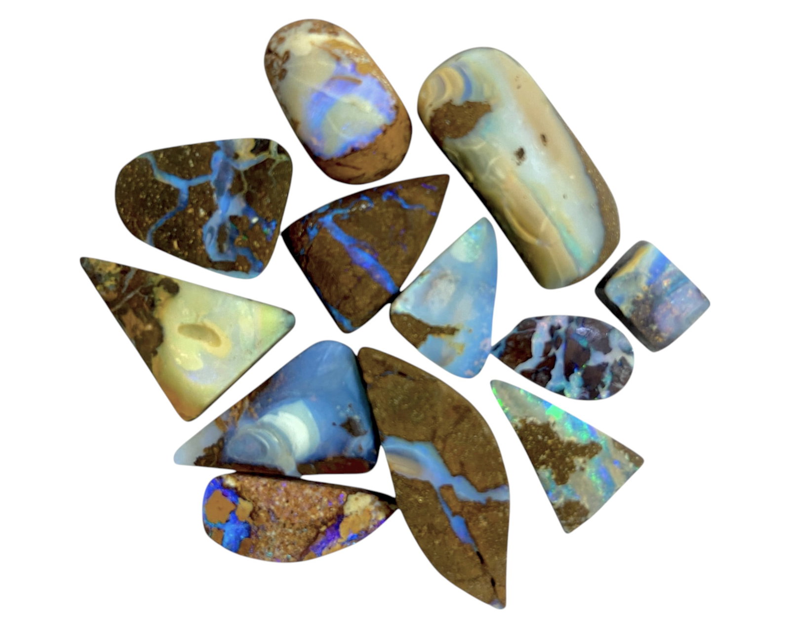 AUSTRALIAN MATRIX BOULDER OPAL - Preform Rough Lot, 12 Pieces, 17g, 8.9-26mm (Images Taken Wet): A dazzling lot of preform Australian matrix boulder opals, with individual sizes. These opals have been rubbed and pre-shaped, highlighting their vibrant natural colors and intricate ironstone matrix 