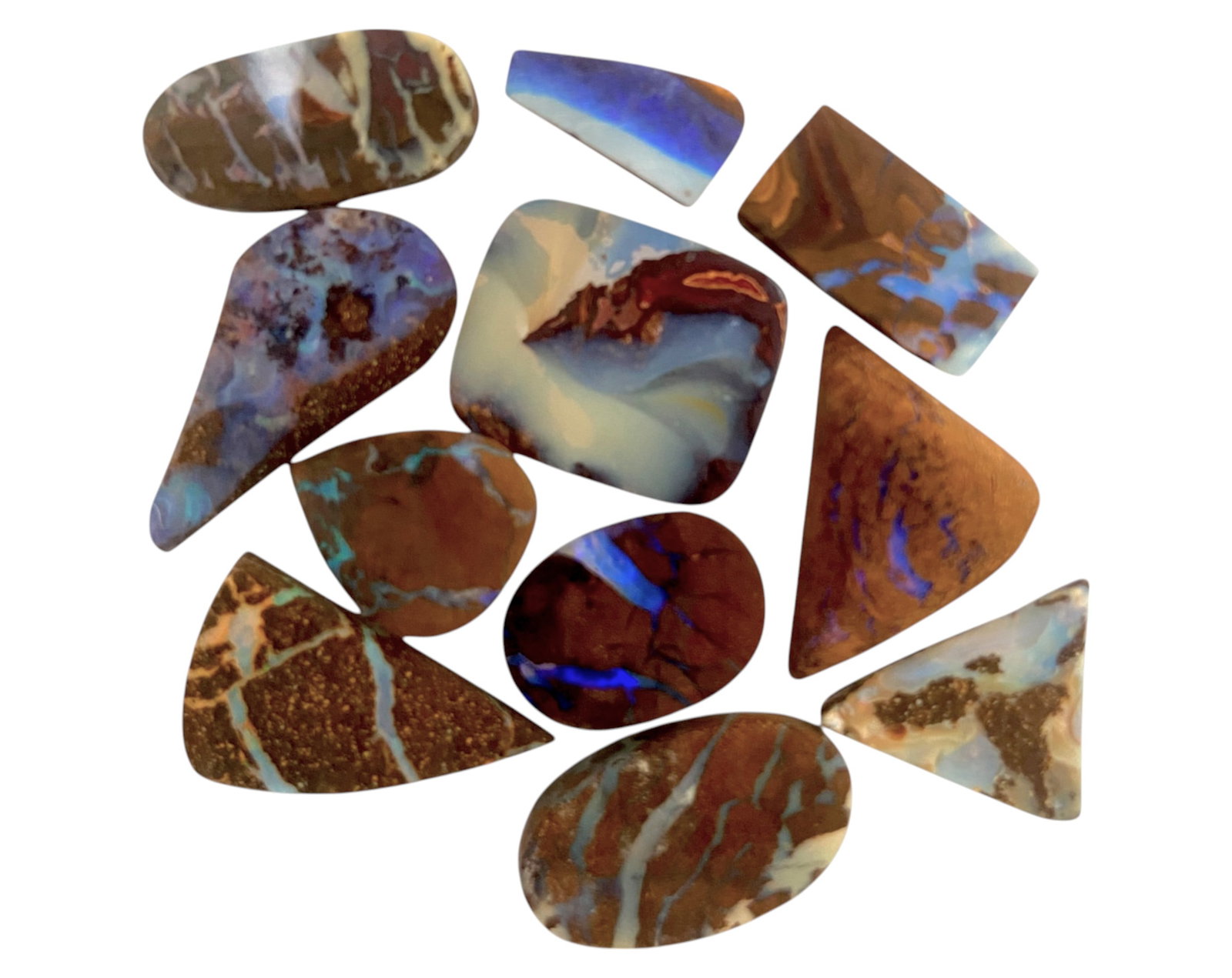 AUSTRALIAN MATRIX BOULDER OPAL - Preform Rough Lot, 11 Pieces, 15.8g, 13-22mm (Images Taken Wet): A dazzling lot of preform Australian matrix boulder opals, with individual sizes. These opals have been rubbed and pre-shaped, highlighting their vibrant natural colors and intricate ironstone matrix 
