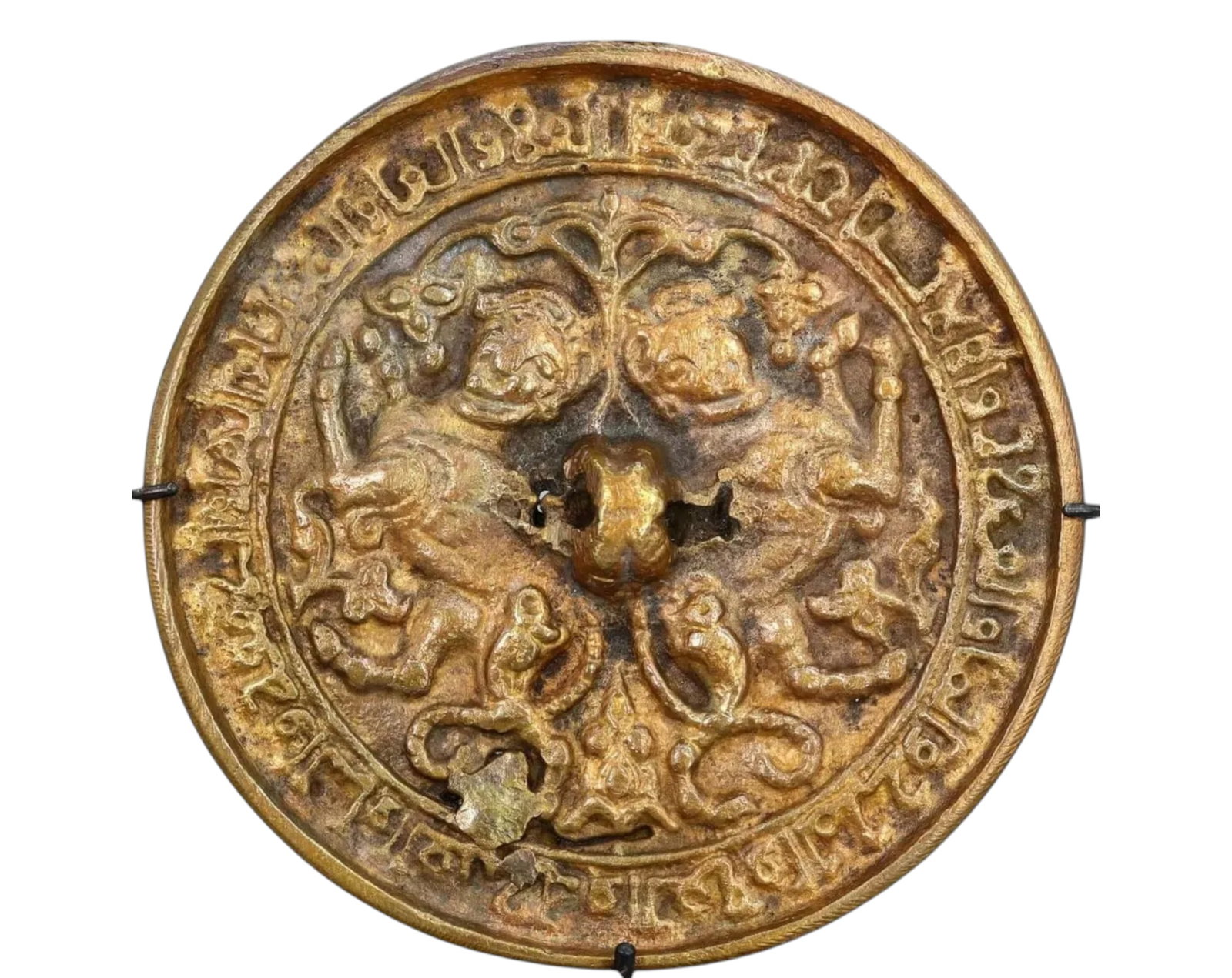 SELJUQ: Bronze Mirror with Addorsed Sphinxes & Scorpion Tails - 12th-13th Century CE: A finely cast bronze mirror from the Seljuq period, dating to the 12th-13th century CE, measuring 10cm in diameter and weighing 316g. This rare example features a pair of addorsed sphinxes with scorpi