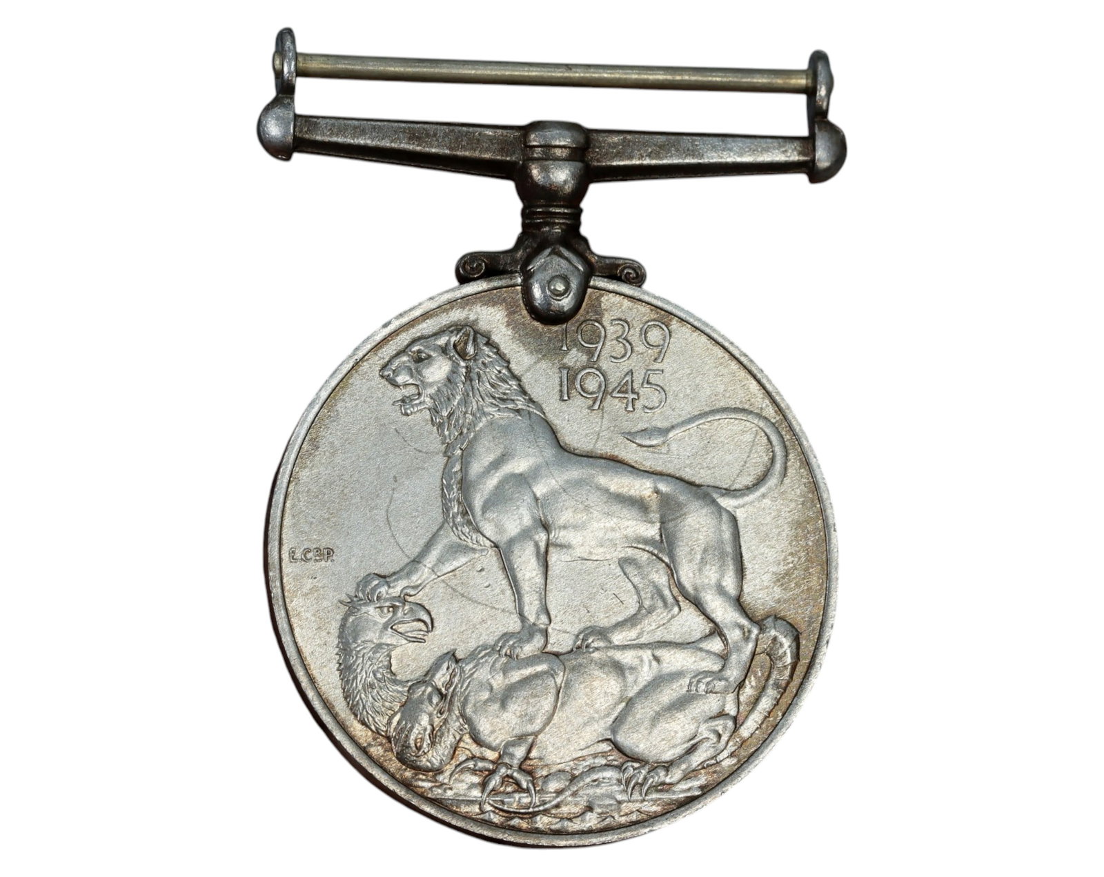 UNITED KINGDOM: WWII War Medal - Silver, 3.6x5cm, 31.7g, 1939-1945: A World War II War Medal, struck in silver, measuring 3.6 x 5 cm and weighing 31.7g. The obverse features the crowned left-facing portrait of King George VI, with the inscription "GEORGIVS VI D:G: BR:
