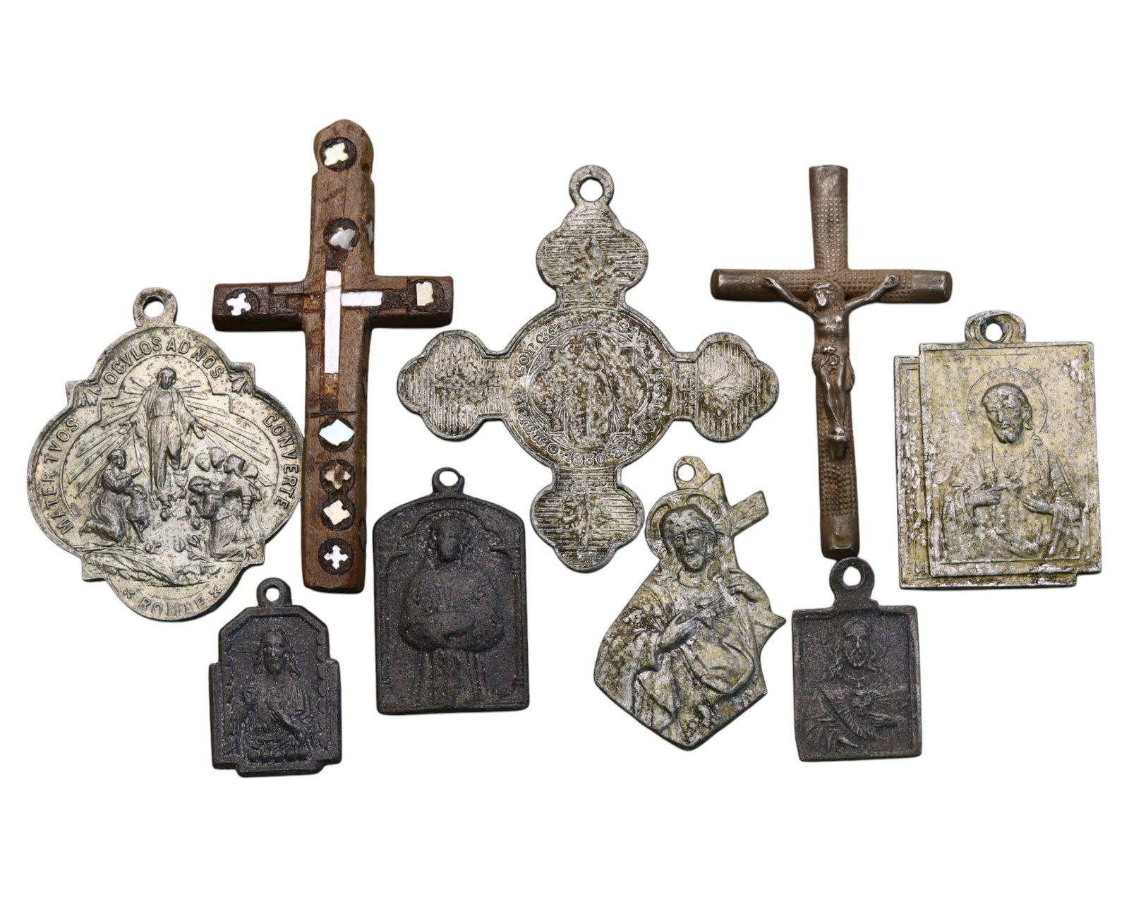 SPAIN/ITALY: Cross & Devotional Medal Lot - Marian Apparitions & Christological Symbols, (9pcs): A remarkable collection of nine religious medals and crucifixes, reflecting deep Catholic devotion. Ranging from 2cm to 5cm and weighing 14g, 19th-20th Century this lot features intricately detailed p
