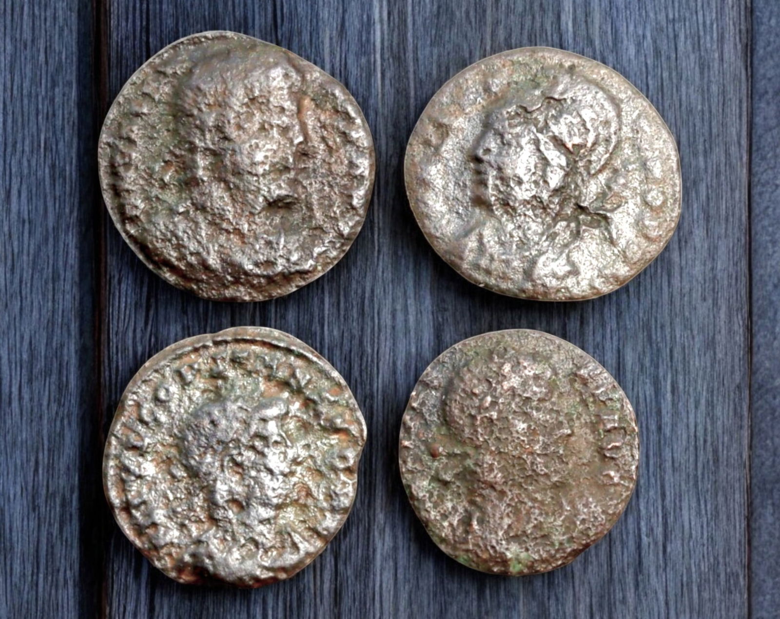 ROMAN EMPIRE: AE Coins - Bronze Coins, 14-16mm, 4.7g (Lot of 4): A collection of ancient Roman bronze coins, each featuring a distinct imperial portrait on the obverse and various symbolic or military-themed reverses. These coins, essential to Roman commerce and go
