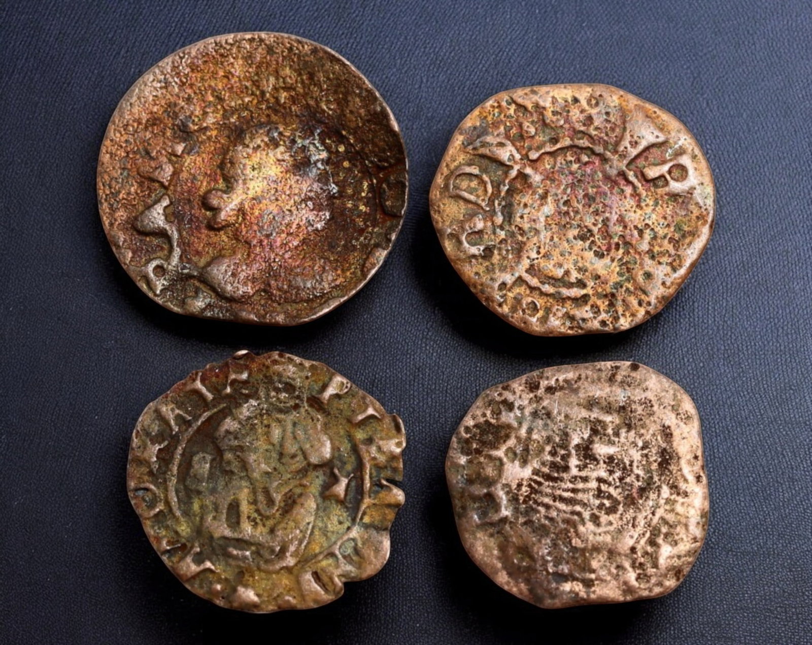 EUROPE: Late Medieval & Early Renaissance Coin Lot - 4pcs, 13-15mm, 2.3g (15th-16th Century): A remarkable collection of four European medieval and early Renaissance coins, dating from the 15th to 16th century. These small yet historically significant coins feature designs ranging from heraldi