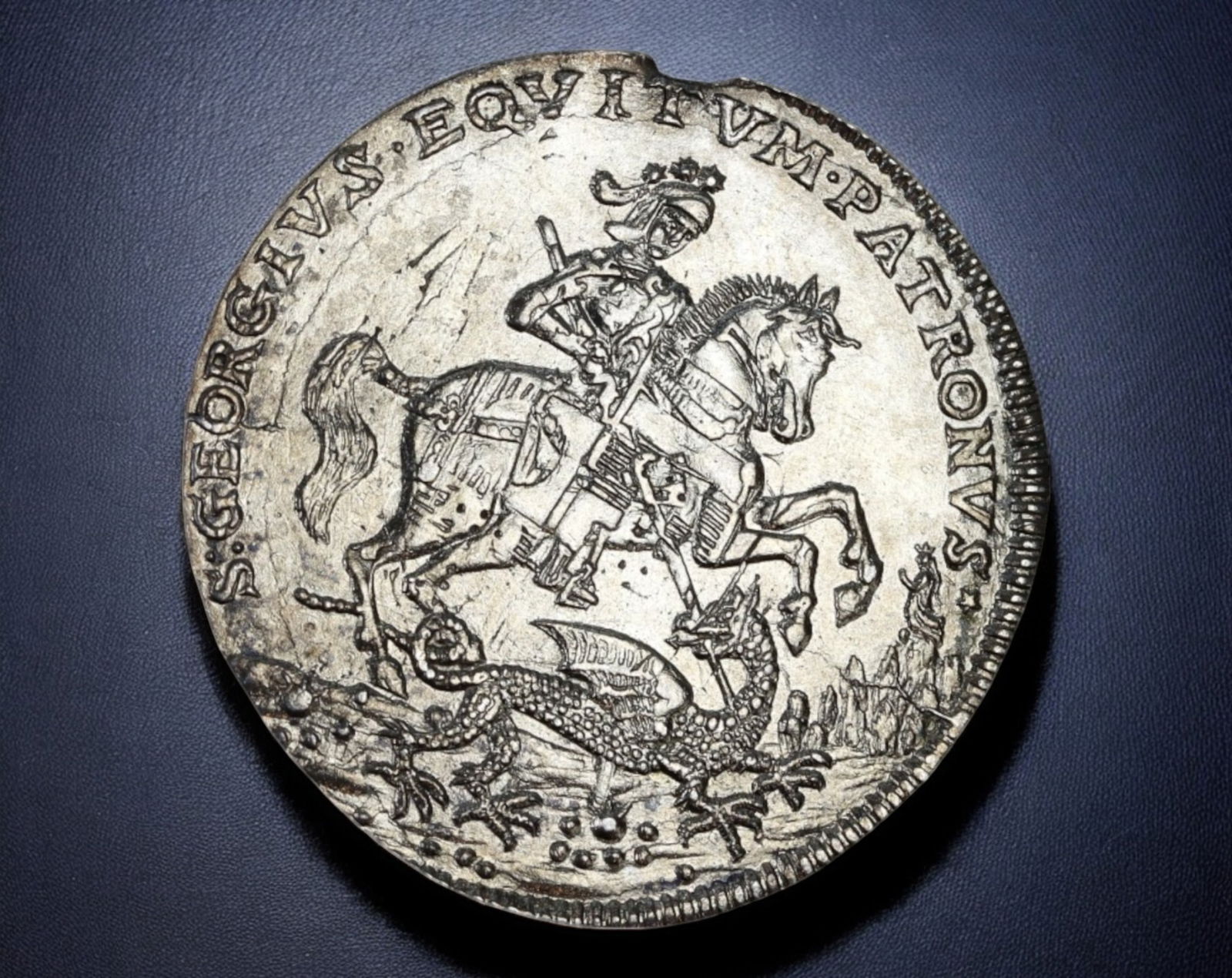 EUROPE: St. George & Maritime Safety Medal Coin - Silver Coin, 19th Century: A finely struck 30mm devotional medal, crafted in silver, weighing 5.9g, likely from the 19th century. The obverse depicts St. George in full armor slaying the dragon, an enduring symbol of bravery an