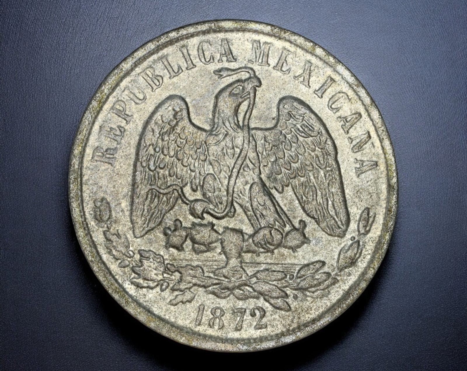 MEXICO: Republic 8 Reales Coin - Silver, 1872: A classic Mexican 8 Reales Coin coin from 1872, struck in silver, measuring 3.8 cm in diameter and weighing 25.7g. The obverse features the iconic Mexican eagle, perched on a cactus while devouring a 