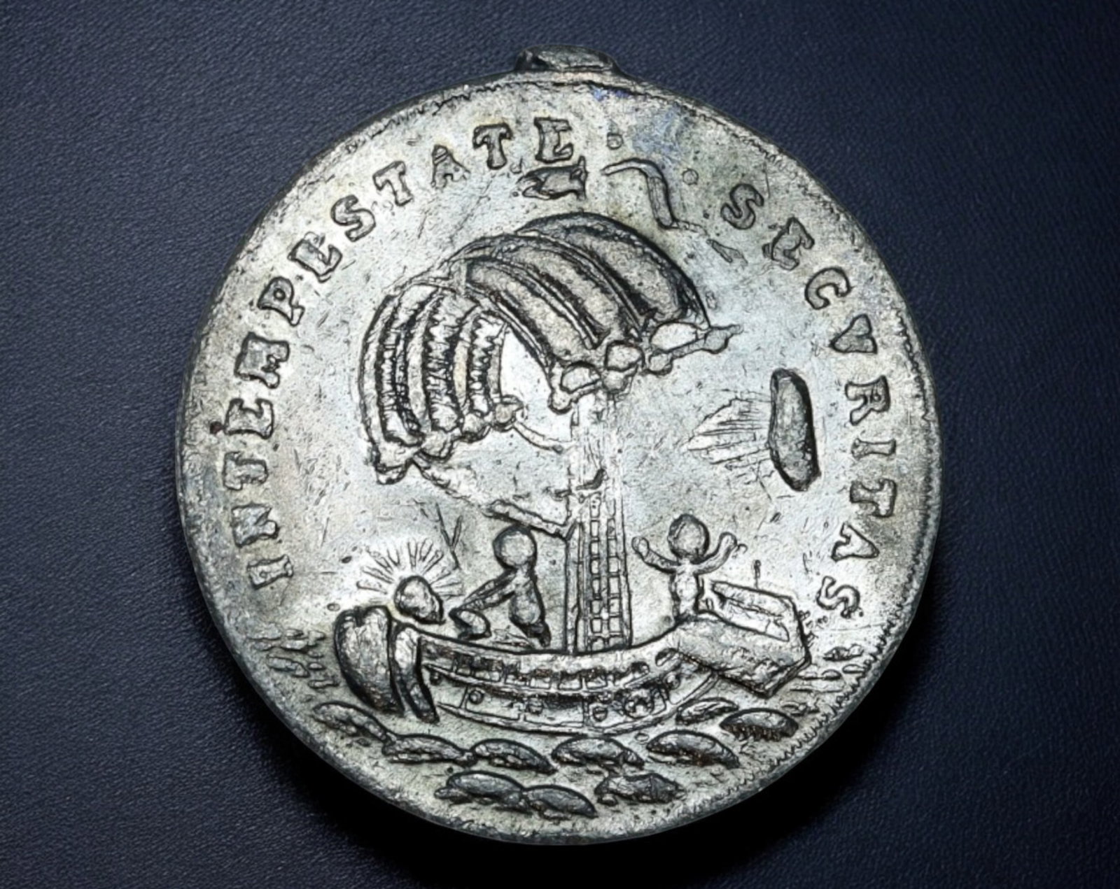 EUROPE: St. George & the Dragon Medal Coin - Silvered, 2.5cm, 4.7g: This silvered devotional medal, measuring 2.5 cm and weighing 4.7g, features St. George slaying the dragon, a powerful symbol of faith and victory over evil. The Latin inscription "S. GEORGIUS EQUITUM