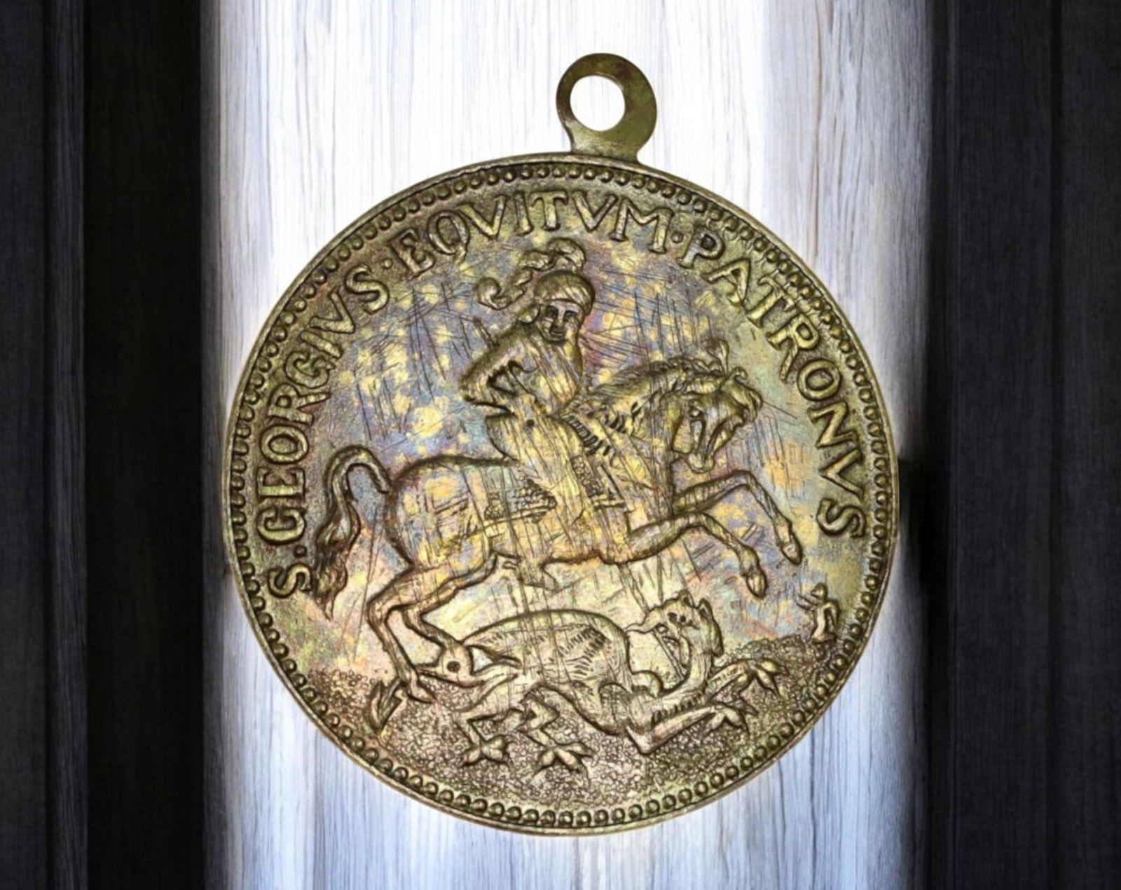 EUROPE: Saint George & "IN TEMPESTATE SECURITAS" Medal - Brass, 2.5x2.9cm, 3.5g, 18th-19th Century: A finely crafted Saint George devotional medal, struck in brass, measuring 2.5 x 2.9 cm and weighing 3.5g. The obverse presents Saint George slaying the dragon, a timeless representation of good trium
