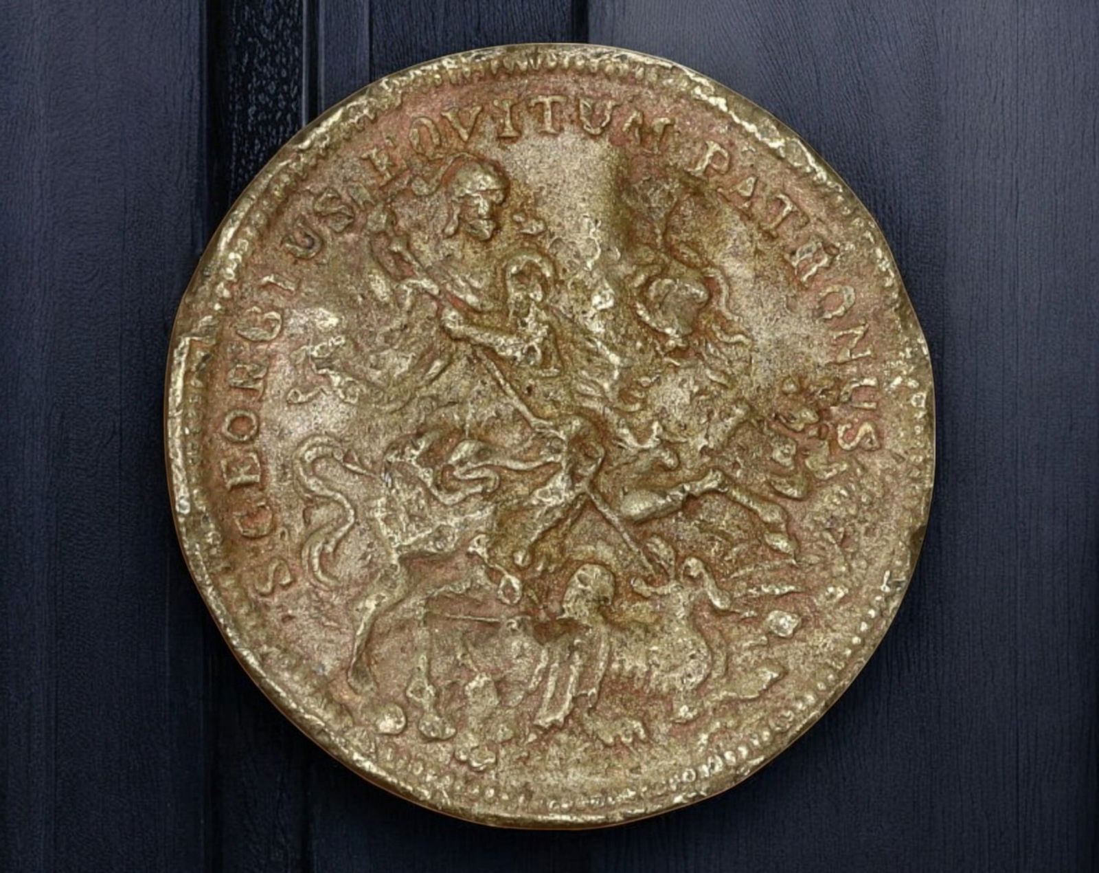 EUROPE: Saint George & "IN TEMPESTATE SECURITAS" Medal - Brass, 2.4cm, 3.6g, 18th-19th Century: A well-worn Saint George devotional medal, struck in brass, measuring 2.4 cm in diameter and weighing 3.6g. The obverse depicts Saint George slaying the dragon, a classic symbol of divine intervention
