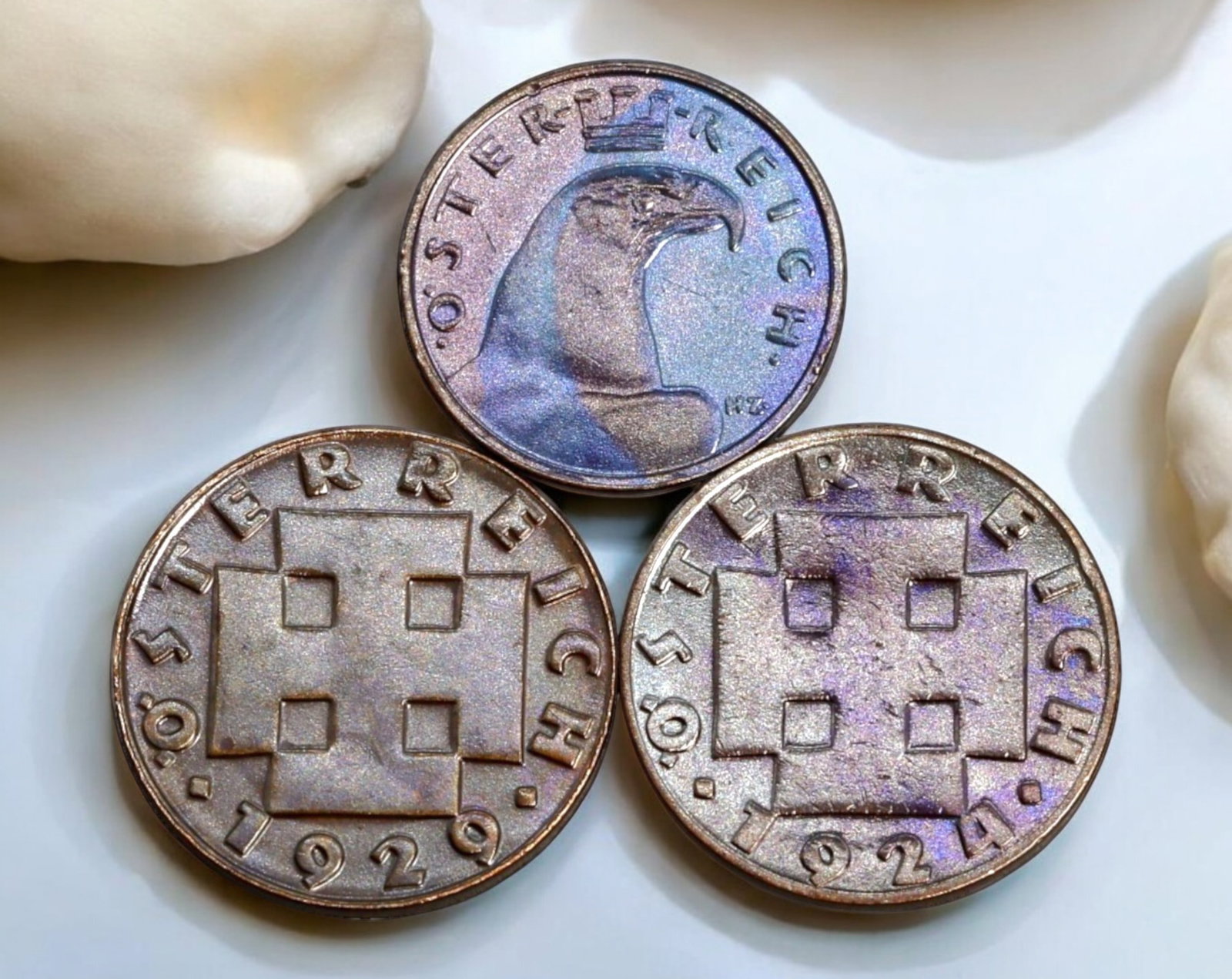 AUSTRIA: Lot of 3 Coins - Early 20th Century, Mixed Denominations: A trio of Austrian coins from the early 20th century, measuring between 17-19mm and weighing a total of 8.3g. The lot includes a 100 Kronen piece from 1924 featuring an oak branch, symbolizing strengt