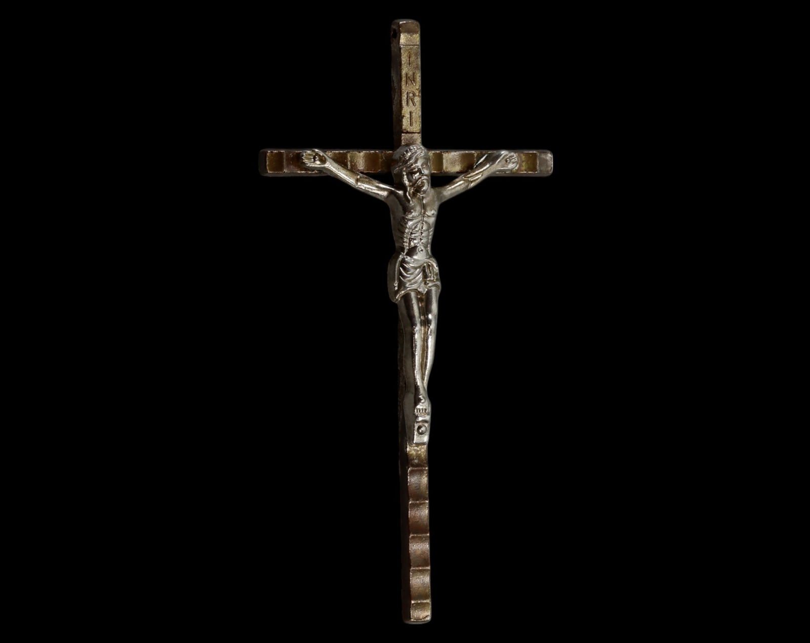 ITALY: Antique Metal Crucifix - 10.5x5.5cm, 23g, Early 20th Century: A finely crafted antique metal crucifix, measuring 10.5 x 5.5 cm and weighing 23 grams. This solid, non-magnetic metal piece features a detailed corpus of Christ with an "INRI" inscription above. The