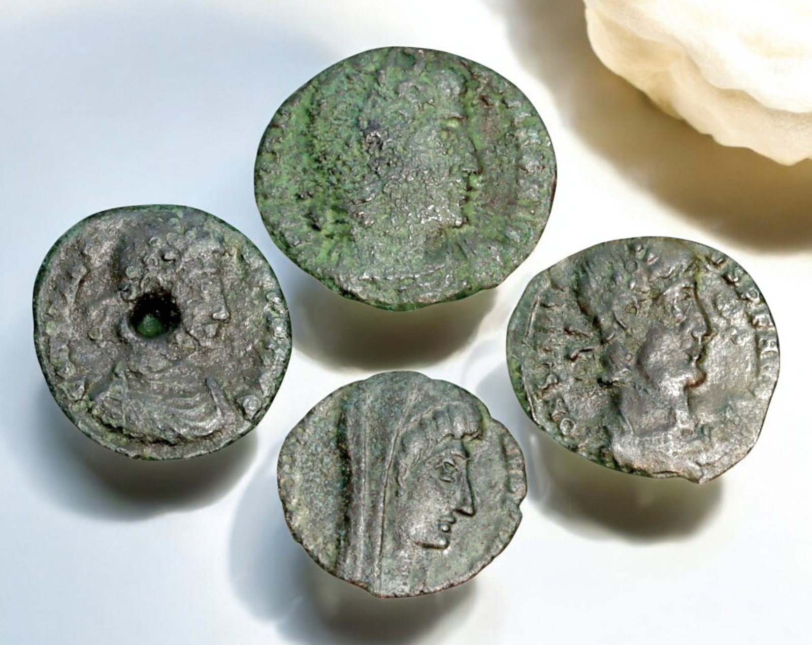 ROMAN EMPIRE: AE Coins - Bronze Coins, 14-17mm, 6g (Lot of 4): A collection of four ancient Roman bronze coins, each featuring a distinct imperial portrait on the obverse and various symbolic or military-themed reverses. These coins, essential to Roman commerce a