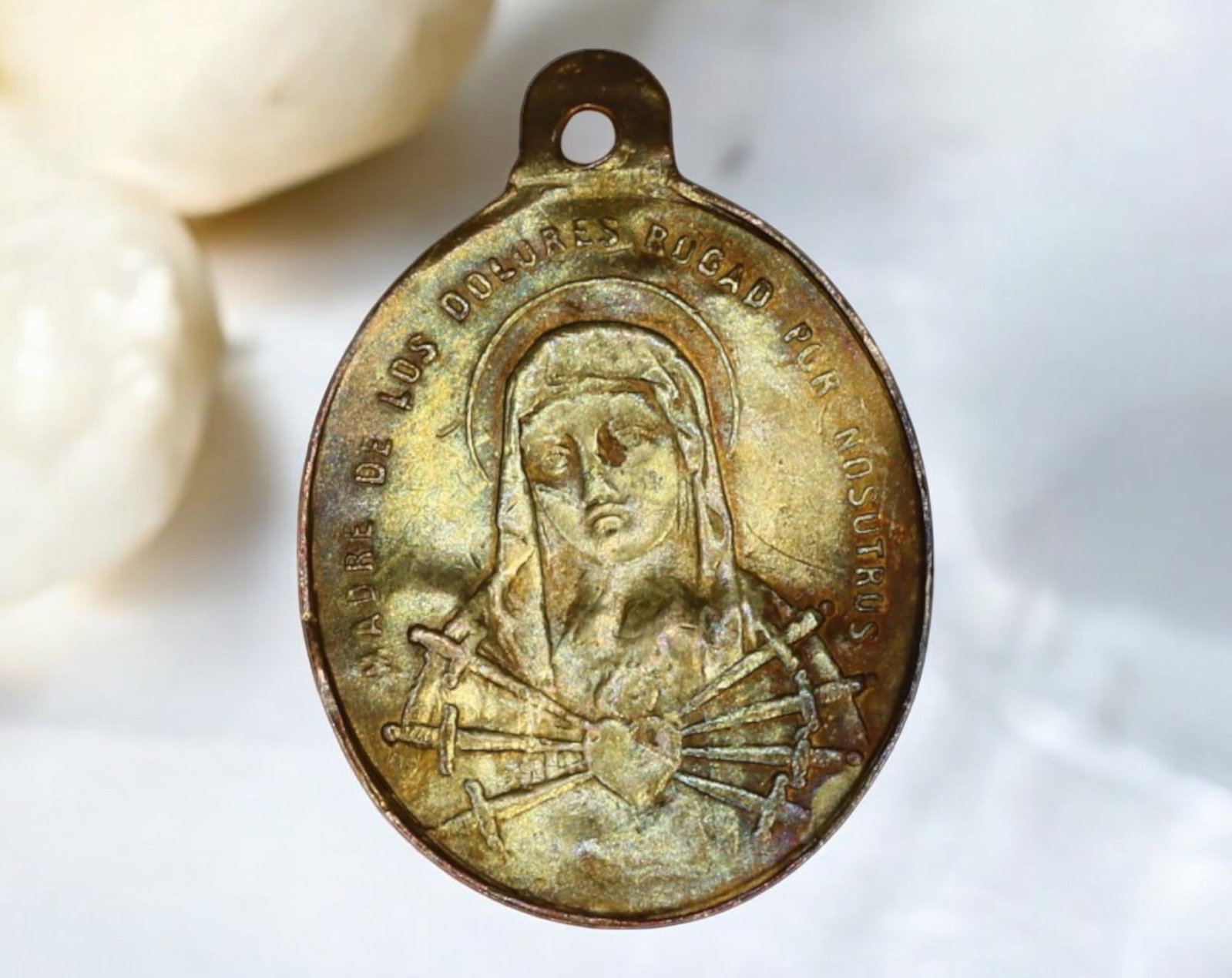 SPAIN: Mater Dolorosa Devotional Medal - Our Lady of Sorrows, 19th Century: This 19th-century Spanish devotional medal honors Our Lady of Sorrows (Mater Dolorosa), a key figure in Catholic devotion. The obverse features a poignant depiction of the Virgin Mary with seven sword