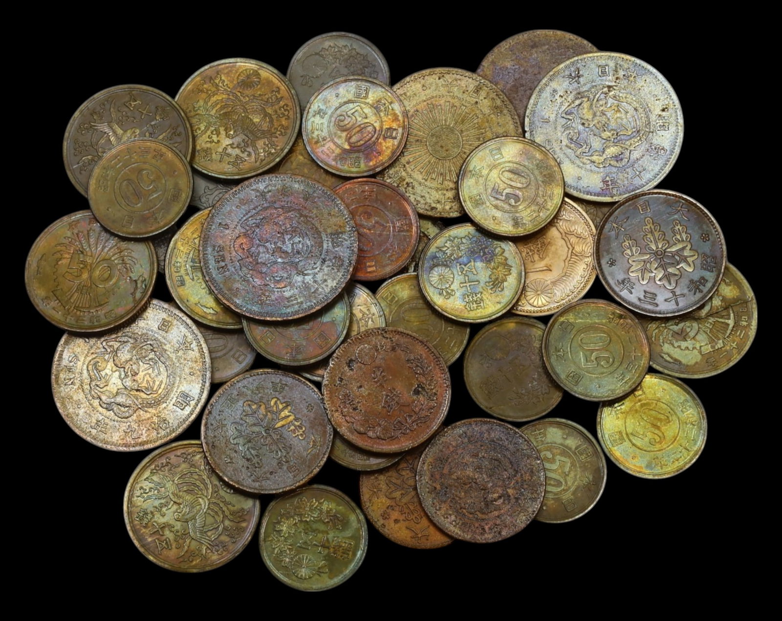 JAPAN: Mixed Lot of 40 Coins - Meiji, Taisho & Showa Eras (1.8-2.5cm): An exceptional collection of 40 Japanese coins, spanning the Meiji (1868-1912), Taisho (1912-1926), and Showa (1926-1989) eras. These coins, measuring 1.8 to 2.5 cm in diameter, showcase various desig