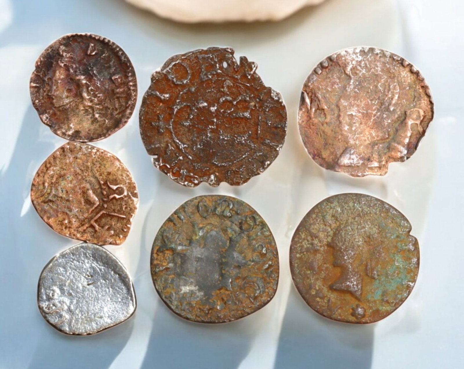 EUROPE: Mixed Antique Coin Lot - 7 Coins, 12-17mm, 3.4g Total, ca. 16th-19th Century: A fascinating assortment of seven small antique European coins, spanning from the 16th to 19th centuries, with diameters ranging from 12-17mm and a total weight of 3.4g. This diverse lot includes silv