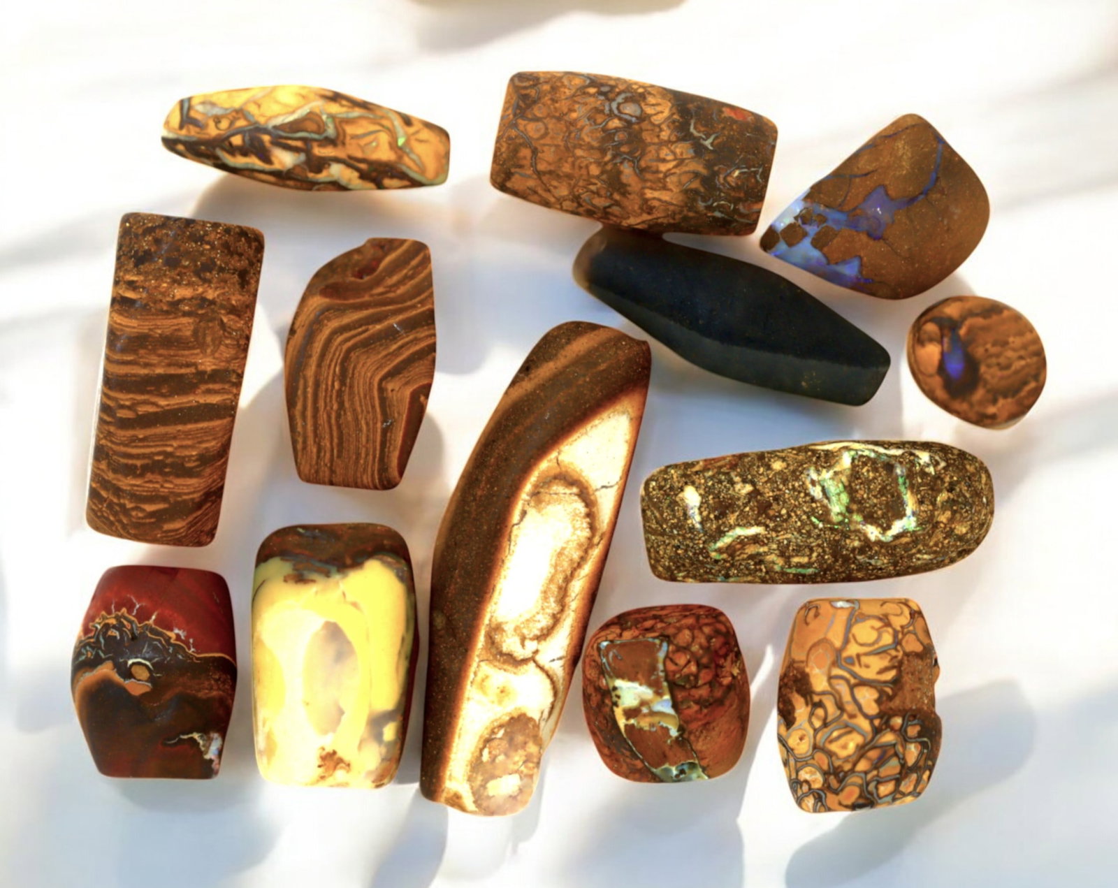 AUSTRALIA: Matrix Boulder Opal Preform Rough Lot, 36g, 1-3cm Each: A stunning selection of matrix boulder opal rough, sourced from Australia's renowned opal fields in Queensland. These preform-cut rough specimens display vivid flashes of blue, green, and purple opale