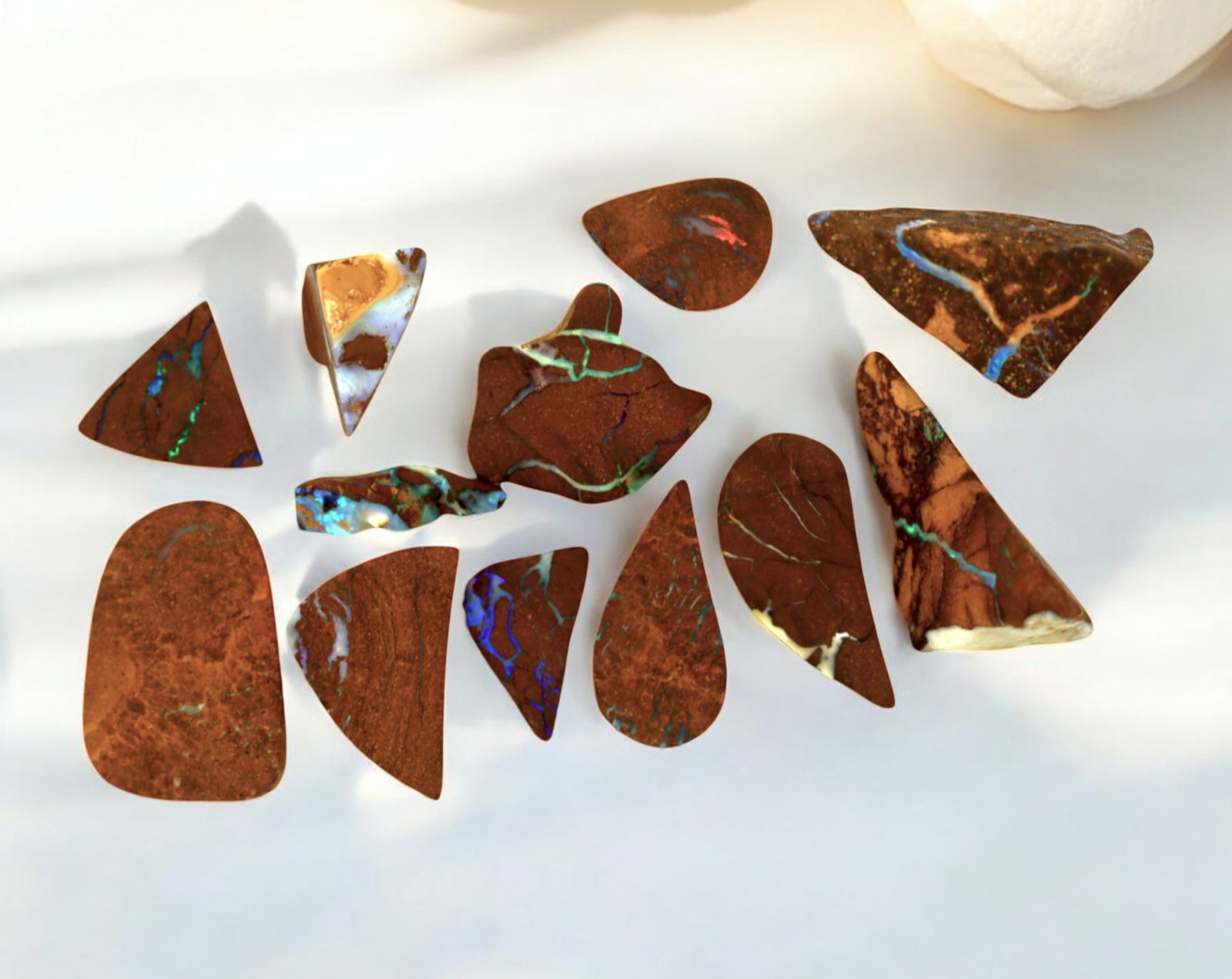 AUSTRALIA: Matrix Boulder Opal Preform Rough Lot, 23g, 1.5-2.5cm Each: A stunning selection of matrix boulder opal rough, sourced from Australia's renowned opal fields in Queensland. These preform-cut rough specimens display vivid flashes of blue, green, and purple opale