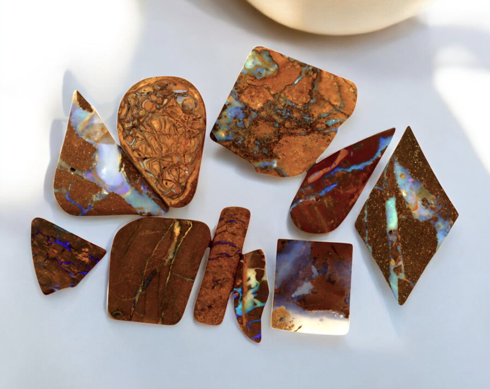 AUSTRALIA: Matrix Boulder Opal Preform Rough Lot, 16g, 1-2.5cm Each: A stunning selection of matrix boulder opal rough, sourced from Australia's renowned opal fields in Queensland. These preform-cut rough specimens display vivid flashes of blue, green, and purple opale
