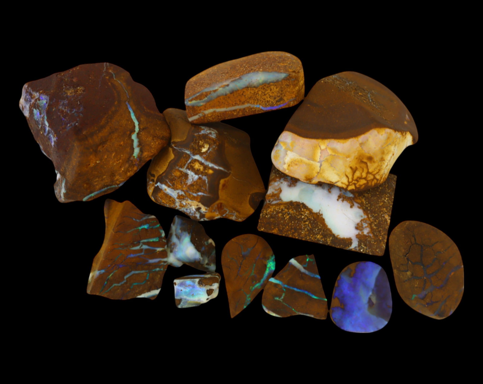 AUSTRALIA: Matrix Boulder Opal Rough Lot, 36g, 0.8-2cm (Images Taken Wet): Stunning lot of natural Australian matrix boulder opal rough, these specimens showcase a vibrant interplay of opalized veins and swirls embedded in rich ironstone, displaying flashes of electric blues