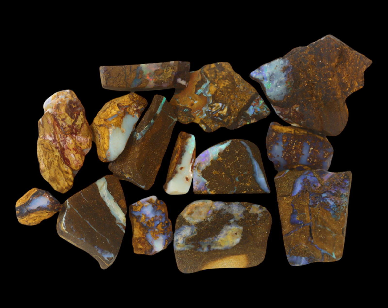 AUSTRALIA: Matrix Boulder Opal Rough Lot, 37g, 1-1.9 cm (Images Taken Wet): Stunning lot of natural Australian matrix boulder opal rough, these specimens showcase a vibrant interplay of opalized veins and swirls embedded in rich ironstone, displaying flashes of electric blues