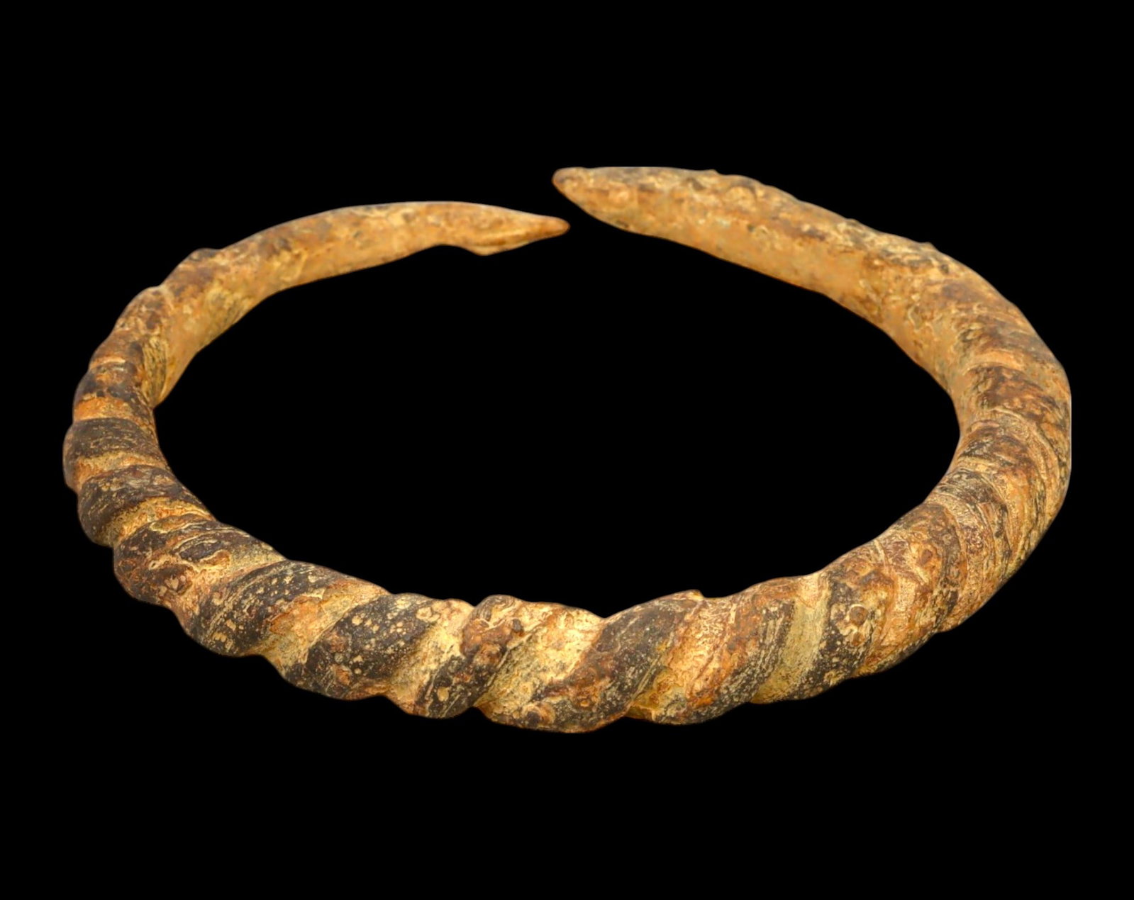 ANCIENT EUROPE: Twisted Bronze Torc Bracelet - Celtic, c. 5th-2nd Century BCE: A robust and finely crafted ancient Celtic bronze torc bracelet, measuring 8.7 x 9 cm and weighing 117g. This exceptional piece features a masterfully twisted design, indicative of high-status adornme