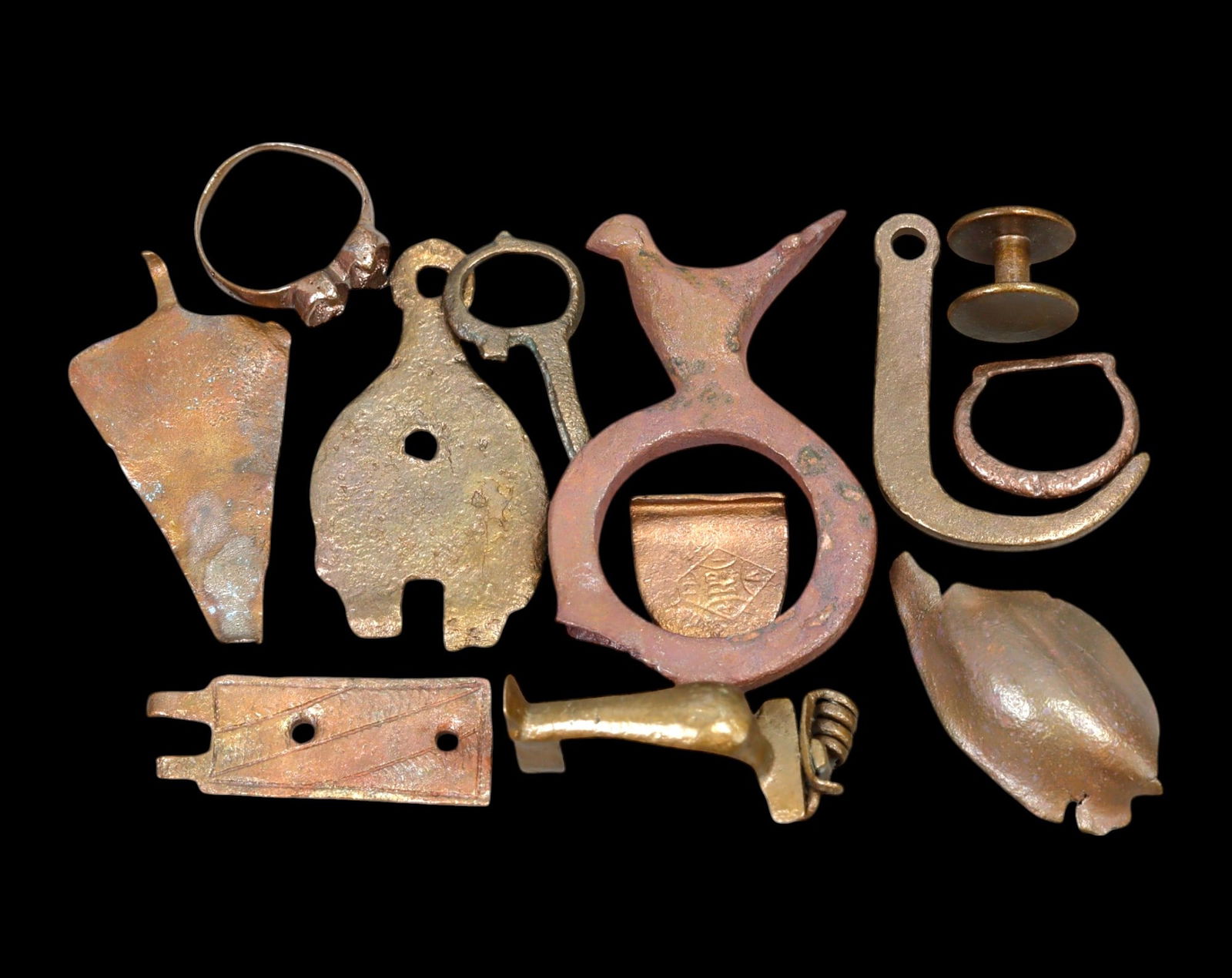 MEDIEVAL & POST-MEDIEVAL: Collection of Bronze Artifacts - Various Forms, c. 12th-18th Century: A diverse assemblage of historical bronze artifacts, ranging in size from 1 cm to 5.3 cm, with a combined weight of 60 grams. This collection includes various functional and decorative objects, possib