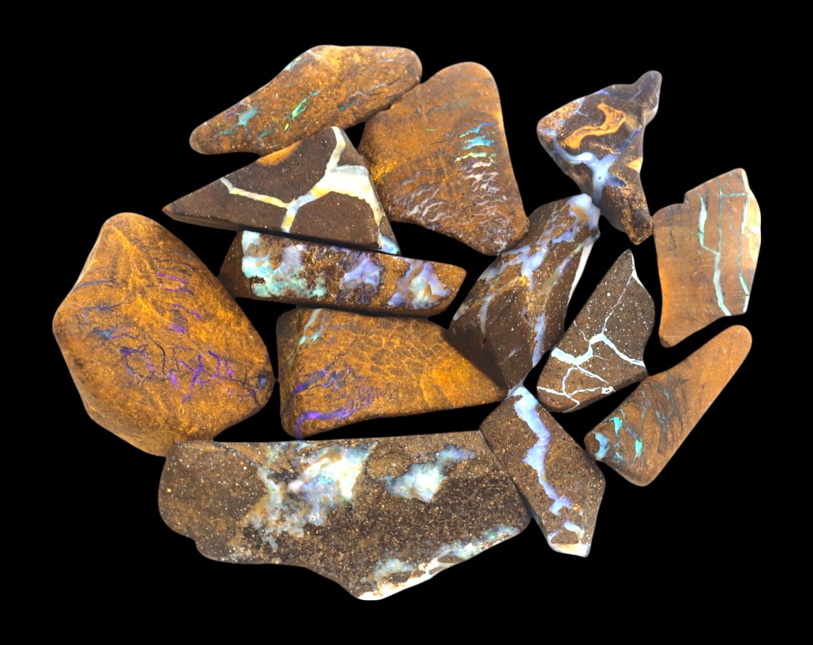 AUSTRALIAN MATRIX BOULDER OPAL - Rough Lot, 1.5-3cm, 27g: A striking lot of natural Australian matrix boulder opal rough. These raw specimens display mesmerizing flashes of blue, green, and gold veins running through ironstone, characteristic of high-quality