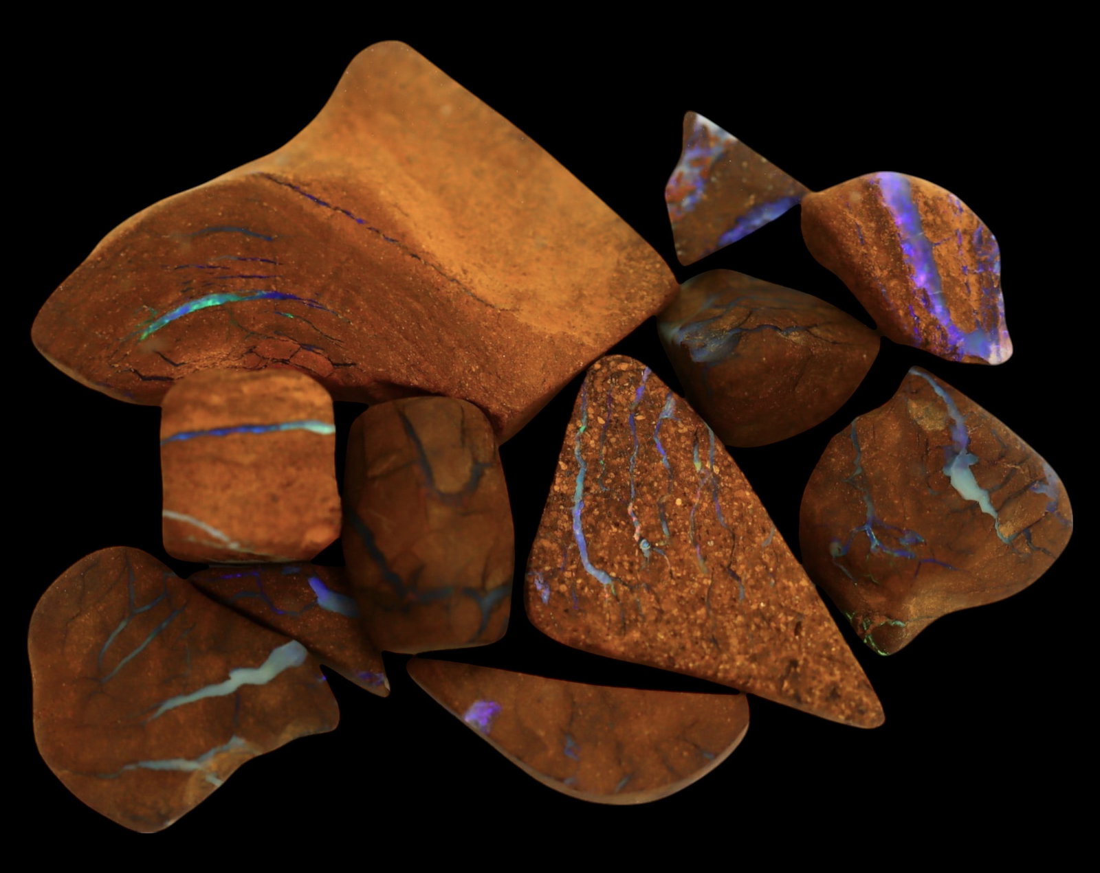 AUSTRALIAN MATRIX BOULDER OPAL - Rough Lot, 1-3.5cm, 21g: A striking lot of natural Australian matrix boulder opal rough. These raw specimens display mesmerizing flashes of blue, green, and gold veins running through ironstone, characteristic of high-quality