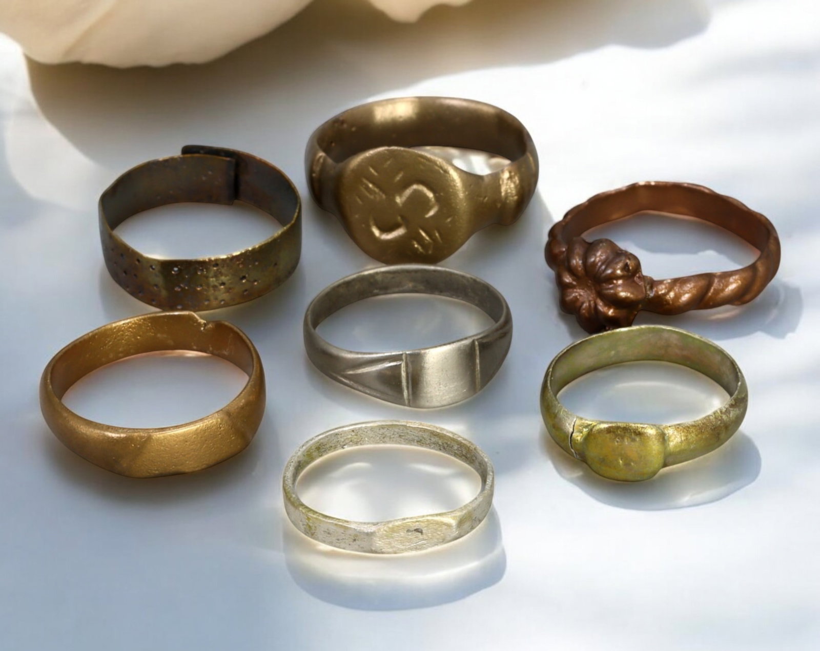 MEDIEVAL EUROPE: Set of Seven Silver & Bronze Rings - 12th-15th Century: A diverse collection of seven medieval rings, crafted from silver and bronze, dating between the 12th and 15th centuries. With sizes ranging from US 6 to 8 and a combined weight of 17g, this set showc