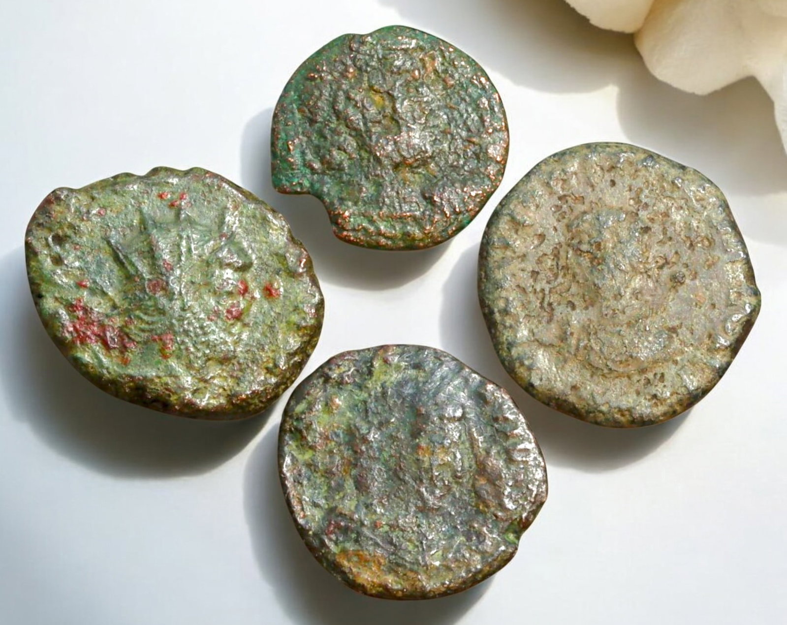 ROMAN EMPIRE: AE Coins - Bronze Coins, 14-17mm, 8.8g (Lot of 4): A collection of ancient Roman bronze coins, each featuring a distinct imperial portrait on the obverse and various symbolic or military-themed reverses. These coins, essential to Roman commerce and go