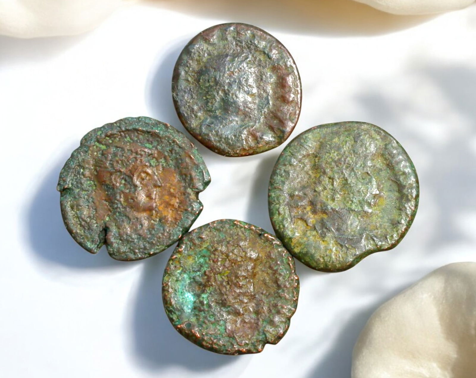 ROMAN EMPIRE: AE Coins - Bronze Coins, 14-16mm, 8.1g (Lot of 4): A collection of ancient Roman bronze coins, each featuring a distinct imperial portrait on the obverse and various symbolic or military-themed reverses. These coins, essential to Roman commerce and go