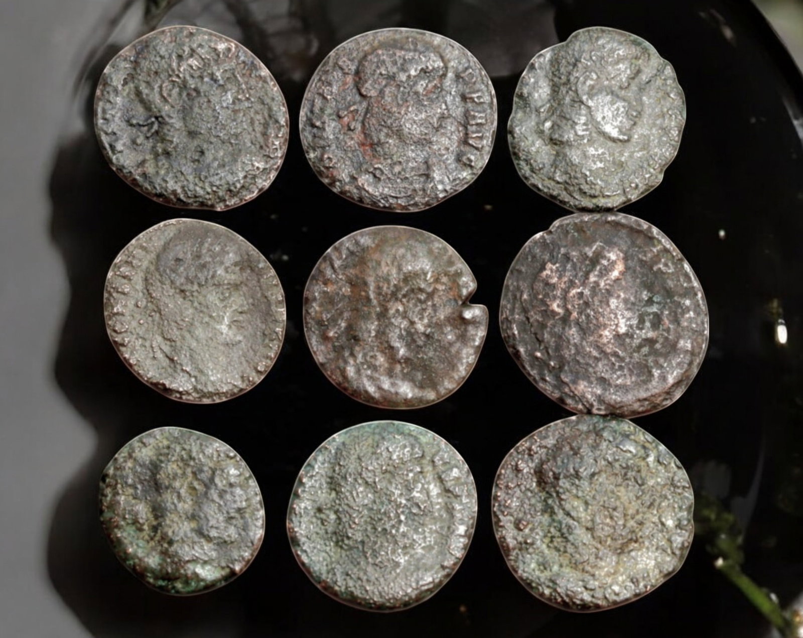 ROMAN EMPIRE: AE Coins - Bronze Coins, 12-17mm, 12.6g (Lot of 9): A collection of ancient Roman bronze coins, each featuring a distinct imperial portrait on the obverse and various symbolic or military-themed reverses. These coins, essential to Roman commerce and go