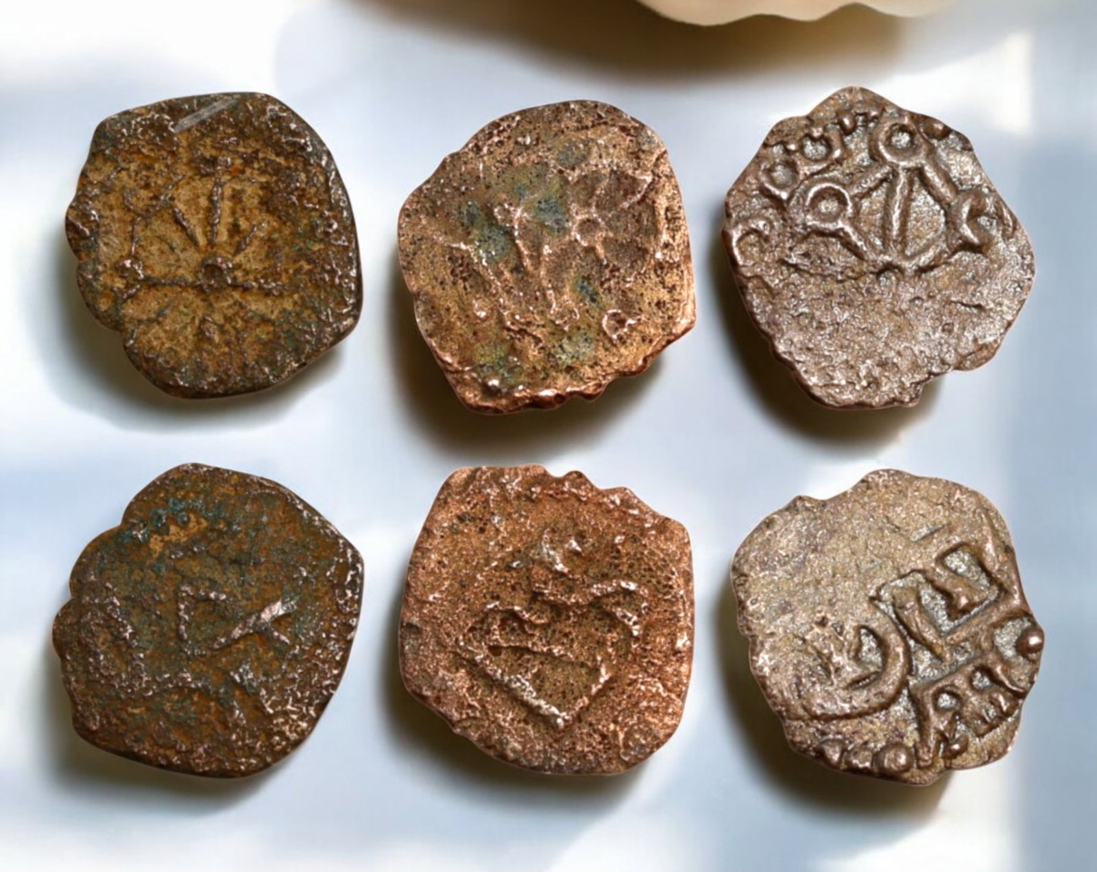 NAVARRE: Medieval Kingdom - 3 Billon Cornado Coins, 13mm, 1.5g Total: A remarkable trio of medieval billon Cornado coins from the Kingdom of Navarre, each showcasing unique symbols and inscriptions characteristic of the region's feudal coinage. These pieces exhibit a ra
