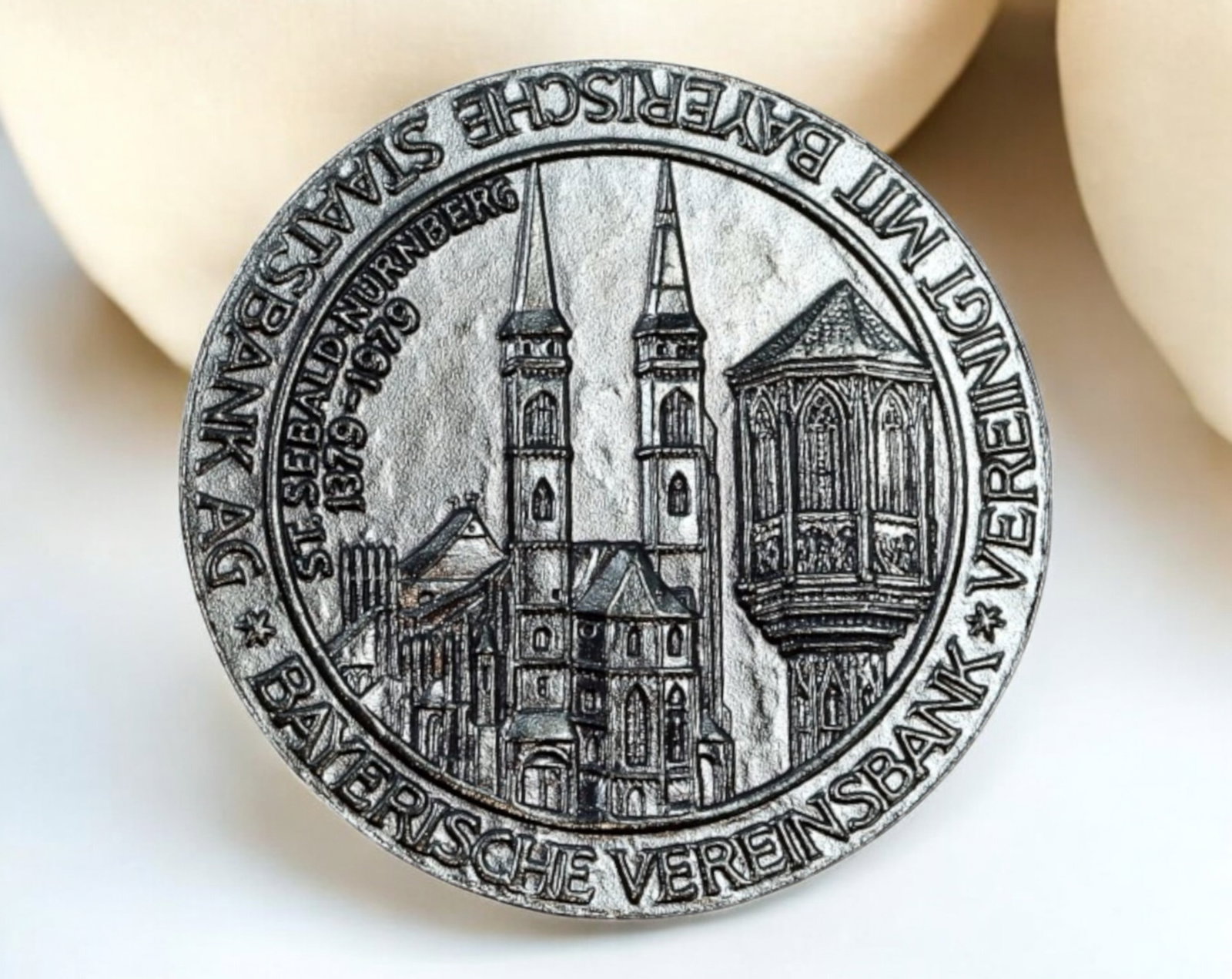 GERMANY: Nurnberg Silver Medal Coin - St. Sebaldus Church, 1379-1979: A finely detailed Silver Medal Coin, 22mm in diameter and weighing 6.8g, commemorating the 600th anniversary (1379-1979) of St. Sebaldus Church in Nuremberg. The obverse showcases a detailed depiction