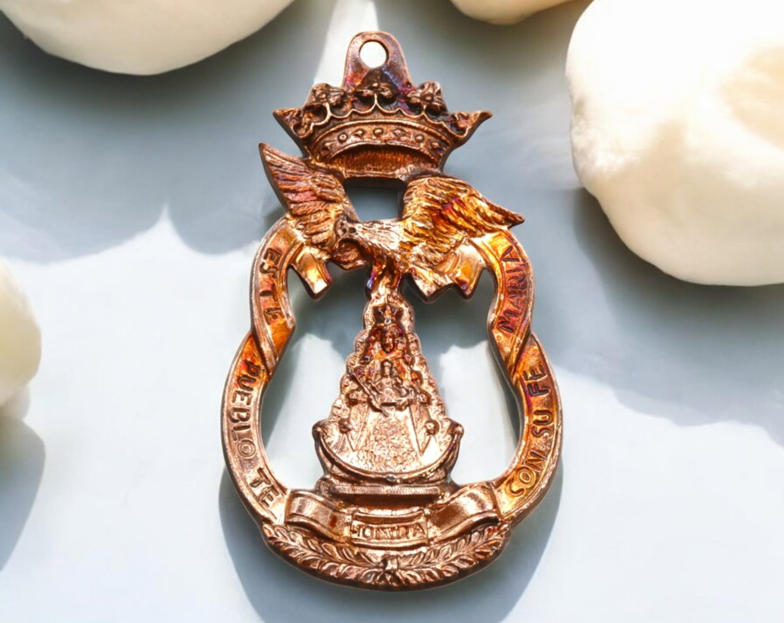 SPAIN: Virgen del Pilar Devotional Medal - Bronze, 19th-20th Century: A finely detailed bronze devotional medal measuring 8.5x4 cm and weighing 38g, dedicated to the revered Virgen del Pilar of Zaragoza. This pierced and crowned design features an elaborate depiction of