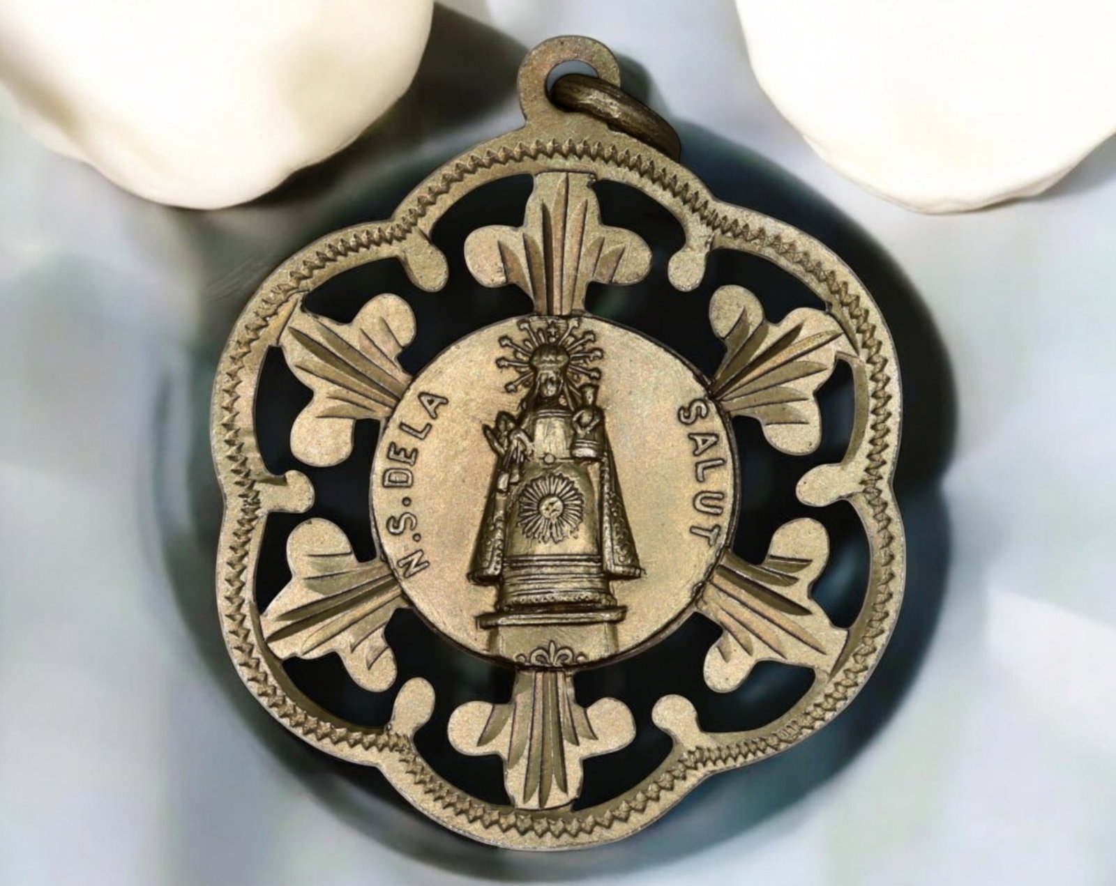 SPAIN: Silver Devotional Medal - Our Lady of Health of Terradas, 3.3g, 4x3cm: This finely crafted silver devotional medal honors Nuestra Senora de la Salut de Terradas (Our Lady of Health of Terradas), a revered Marian devotion in Catalonia. The obverse showcases the crowned Vi