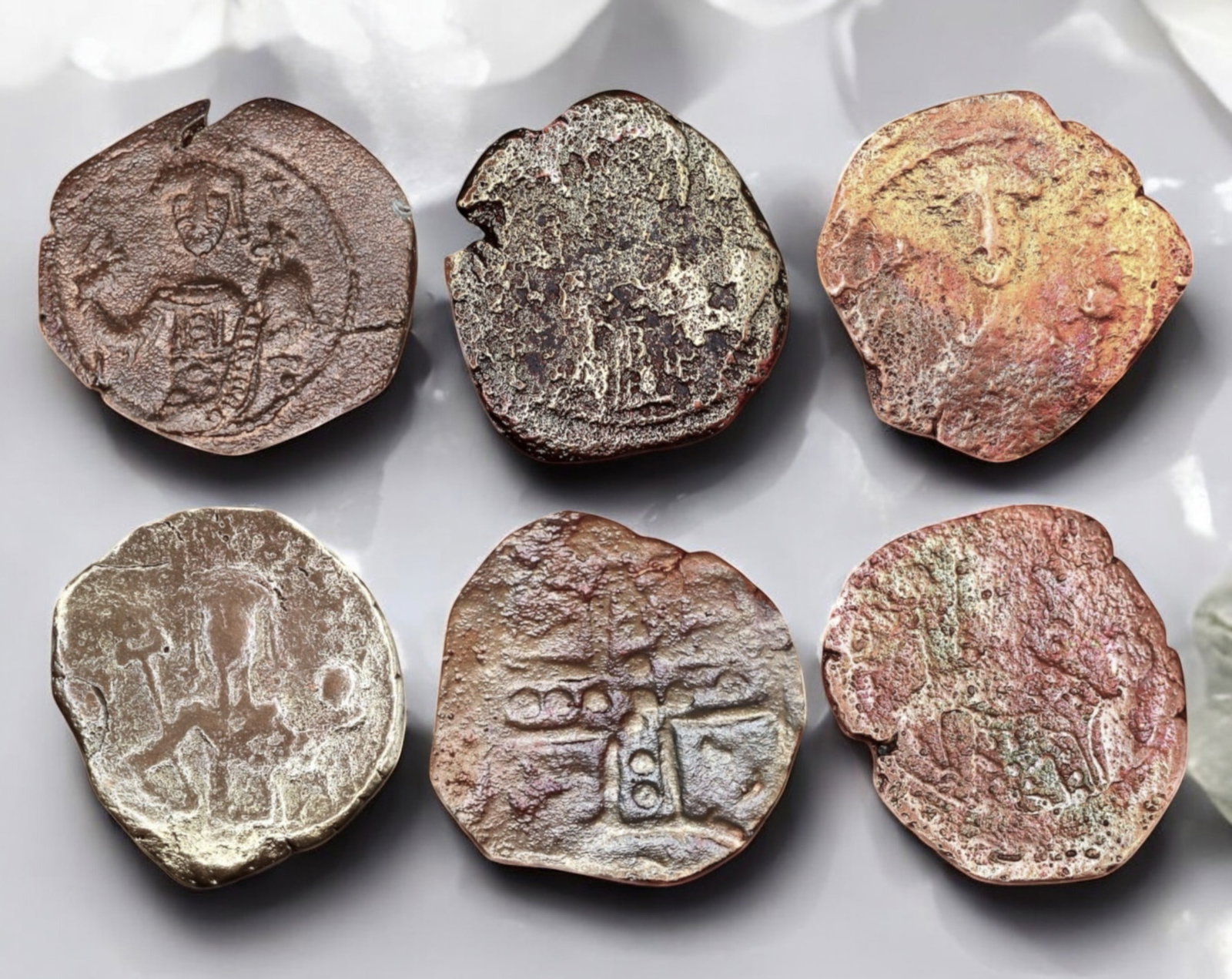 BYZANTINE EMPIRE: Lot of 6 AE Follis Coin - Christ, Imperial & Cross Types, 15-20mm: A varied lot of six Byzantine bronze folles, showcasing a mix of imperial busts, Christ Pantokrator, and cross motifs, key elements of medieval Byzantine numismatics. Some coins display a ruler holdin