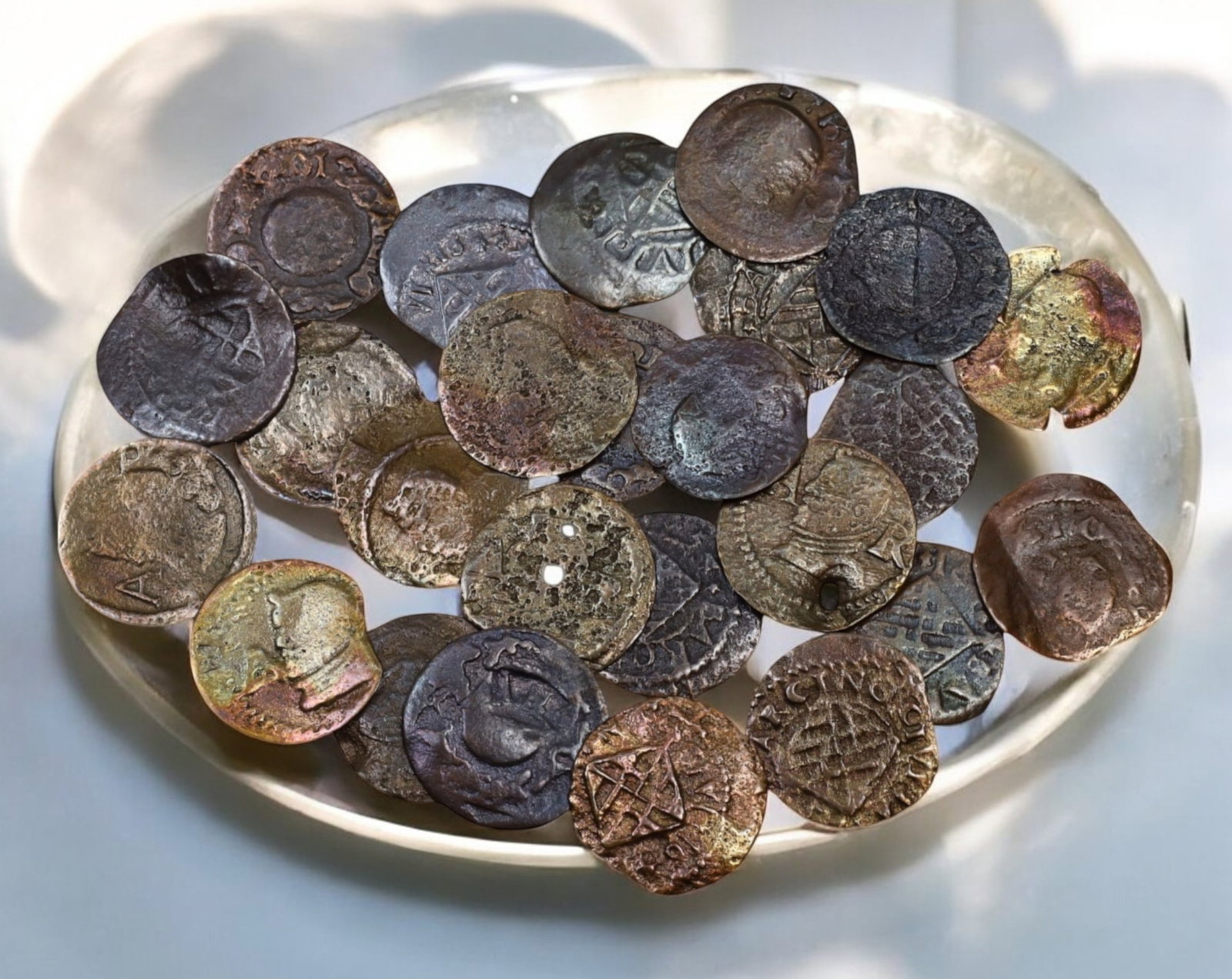 SPAIN: Lot of 25 Ardite Coins - 17th-18th Century (20g, 1.5cm): A fascinating lot of Spanish Ardite coins, struck in copper and circulated between the 17th and 18th centuries under various Spanish monarchs. Each coin, approximately 1.5 cm in diameter and weighing 