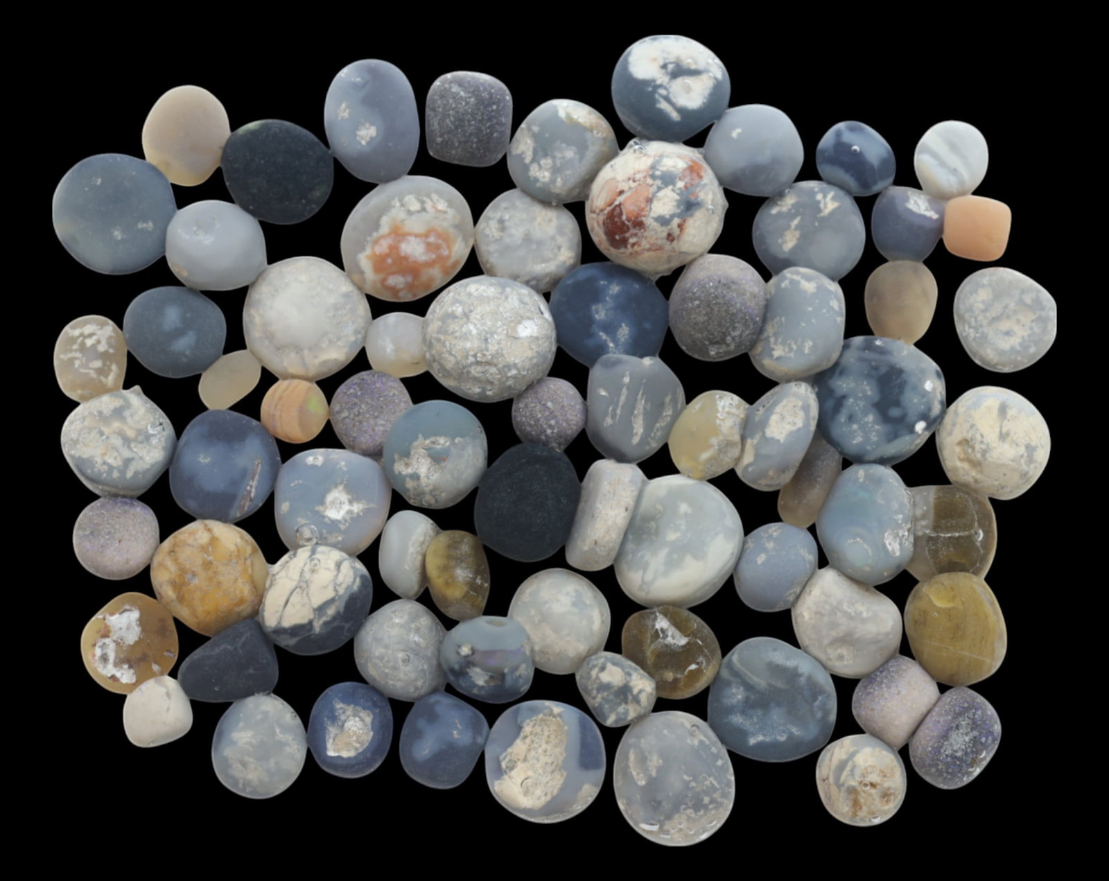 AUSTRALIA: Lightning Ridge Opal Preform Rough Lot - 74g, 5-15mm, Select Australian Specimens: A premium selection of Lightning Ridge opal preforms, weighing 74g, with individual pieces ranging from 5mm to 15mm. These naturally rounded and tumbled opals exhibit various blue, gray, and honey ton