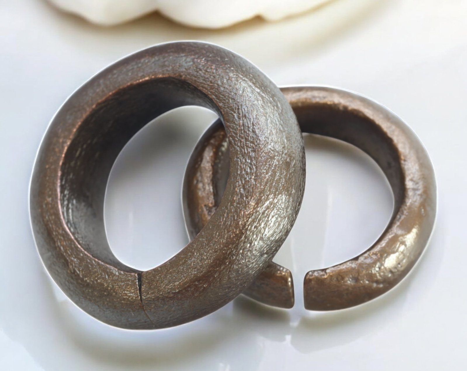 CELTIC PROTO-RING CURRENCY - Bronze, 3 Pieces, 3.2-3.7cm, 84g: A trio of ancient-style Celtic proto-ring currency pieces, each measuring 2.8-3.1 cm in diameter and collectively weighing 54g. These distinctive open-ended bronze rings, exhibiting a rich patina and 