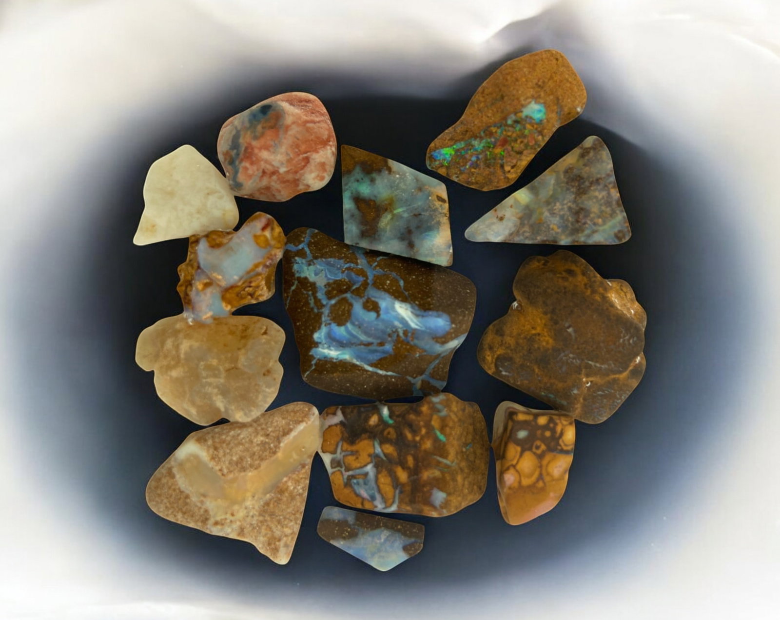 AUSTRALIAN MATRIX BOULDER OPAL - Rough Lot, 26.8g, 1.25-2.3cm Each: A striking lot of natural Australian matrix boulder opal rough. These raw specimens display mesmerizing flashes of blue, green, and gold veins running through ironstone, characteristic of high-quality