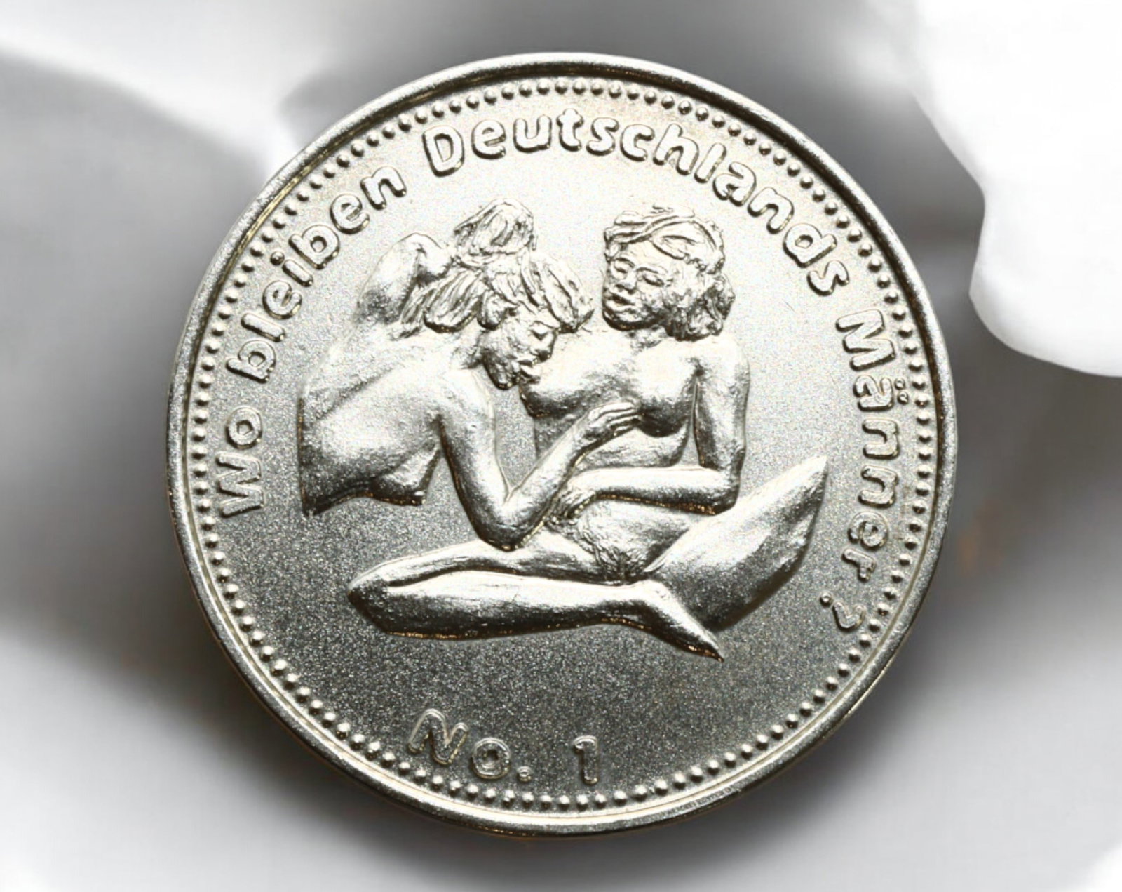 GERMANY: Erotic-Themed Fantasy Token - "Sex Mark," No. 1: A satirical and risqu? fantasy token, struck in a silver-colored alloy, measuring 30mm in diameter and weighing 12g. The obverse features an intimate erotic scene with the inscription "Wo bleiben Deut