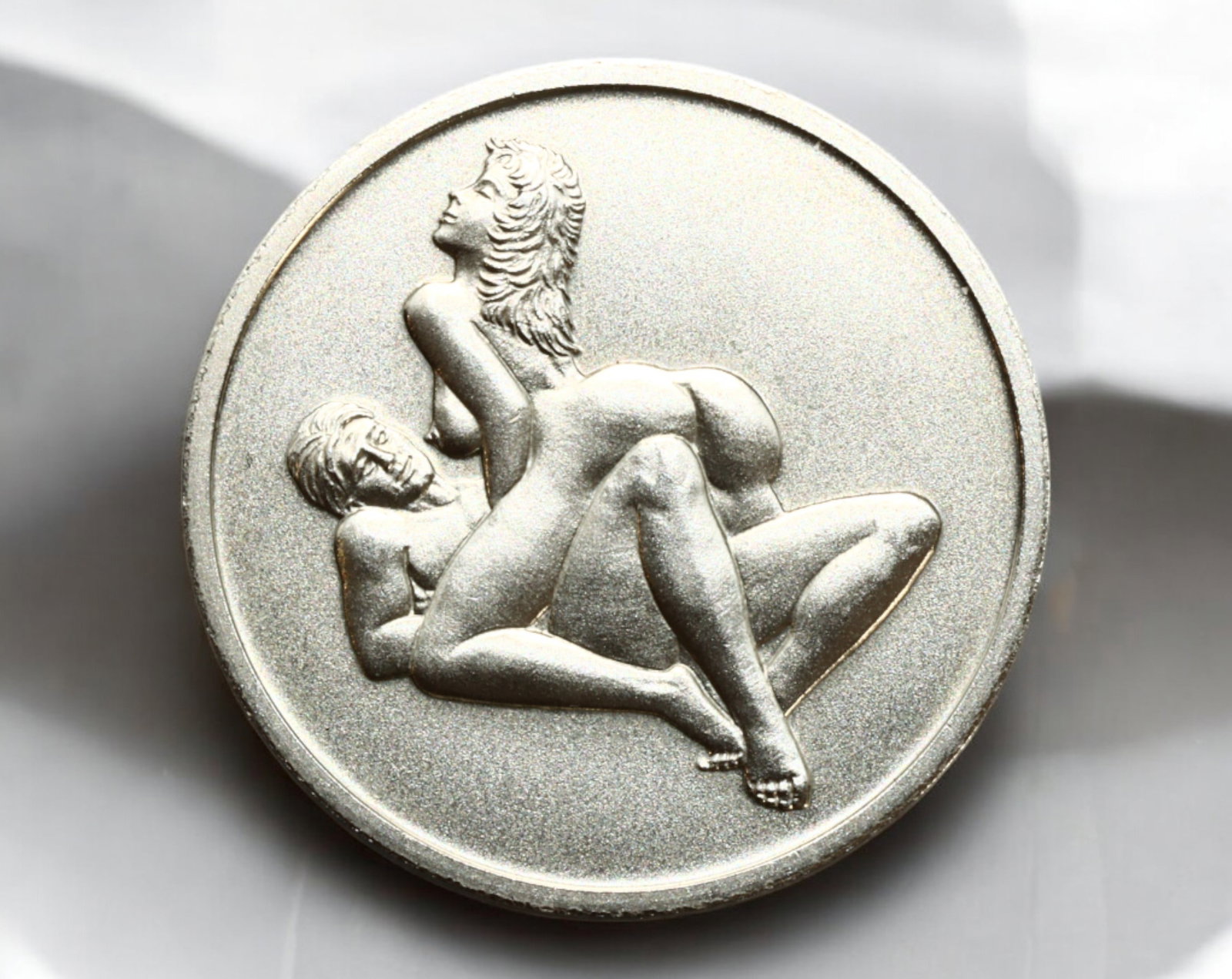 GERMANY: Erotic-Themed Fantasy Token - "Sex Mark": A provocative and minimalist fantasy token, struck in a silver-colored alloy, measuring 31mm in diameter and weighing 13g. The obverse features an explicit erotic scene without any inscriptions, focus