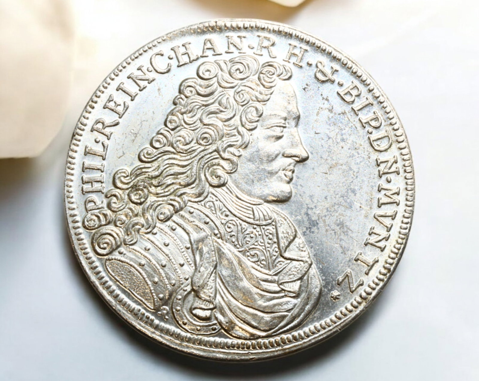 GERMANY: Trimm Taler Silver Medal - Philipp Reinhard of Hanau, 1995: A commemorative 1995 Trimm Taler silvered medal, measuring 40mm in diameter and weighing 25g, blending historical and modern elements. The obverse features a finely detailed bust of Philipp Reinhard, 