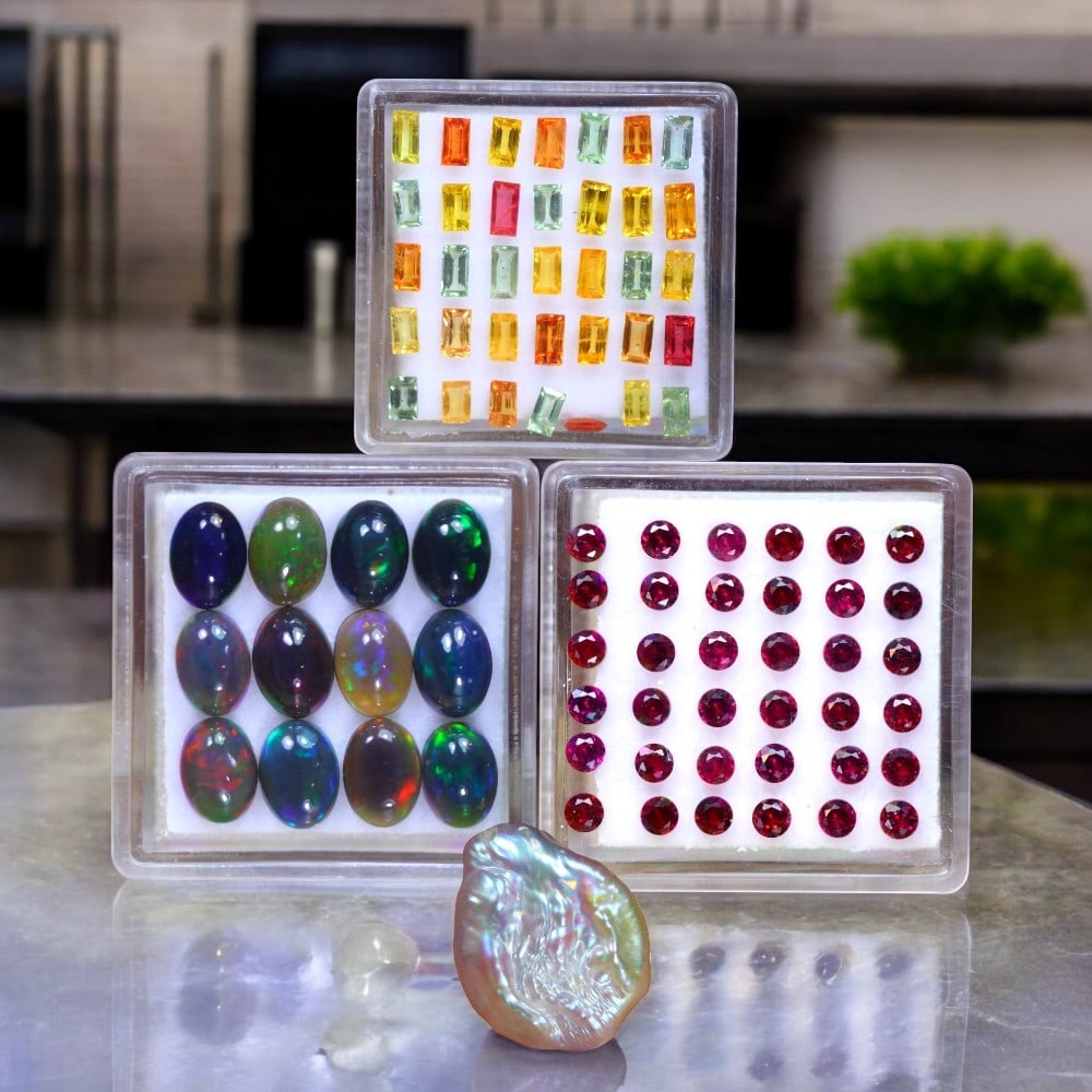 Fancy Color Sapphire, Keshi Pearl, Welo Black Opal & Garnet: A captivating ensemble of rare and vibrant gemstones, each offering exceptional beauty and character. The Fancy Color Sapphire set (35pcs, 4.48ct total, 4.0x2.2x1.4mm) displays a dazzling array of hue