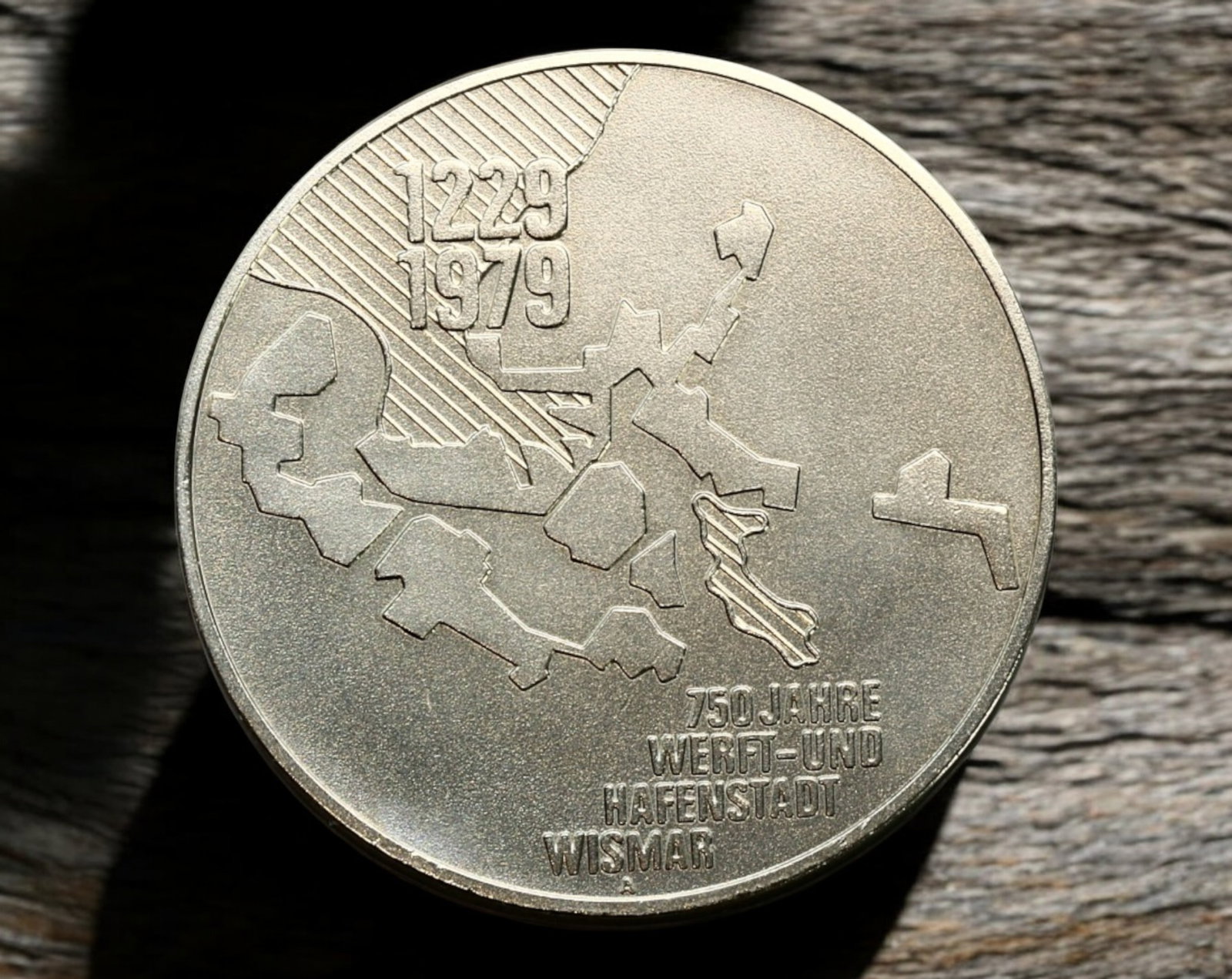 EAST GERMANY (GDR): 750 Years of Wismar - Silver Medal, 1979: A commemorative silver-colored medal issued in 1979 to celebrate the 750th anniversary of Wismar, an important shipbuilding and port city in East Germany. Struck in a nickel alloy, this medal measures