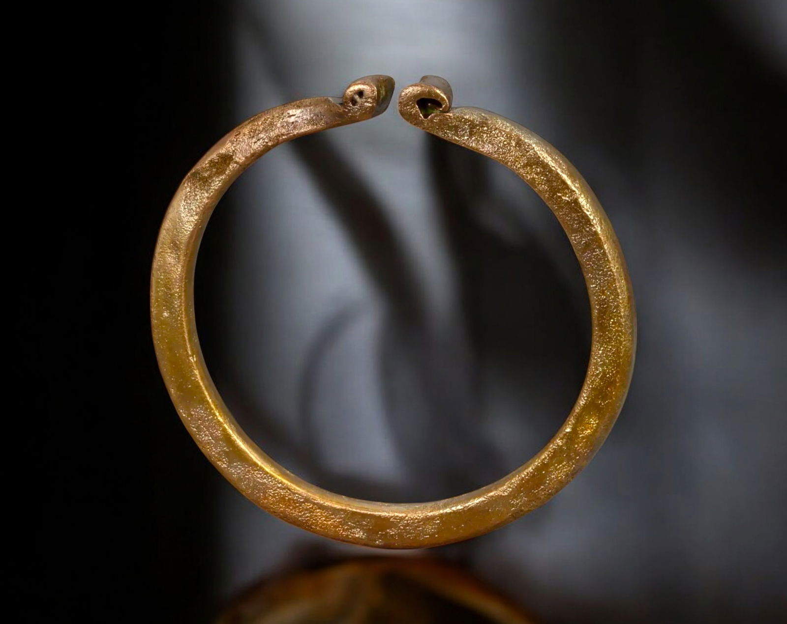 AFRICAN TRADE: Coiled Serpent Bangle - Bronze Manilla Form with Snakehead Terminals, 8.8 cm (1 of 2)