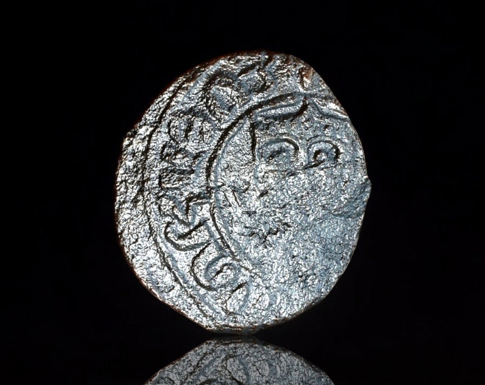 ARMENIA: Cilician Kingdom - AE Kardez Coin, 13th-14th Century: A bronze Kardez Coin from the Cilician Armenian Kingdom, measuring 21x23mm and weighing 2.7g. The obverse features a crowned facing bust of the king, though partially worn due to circulation. The reve