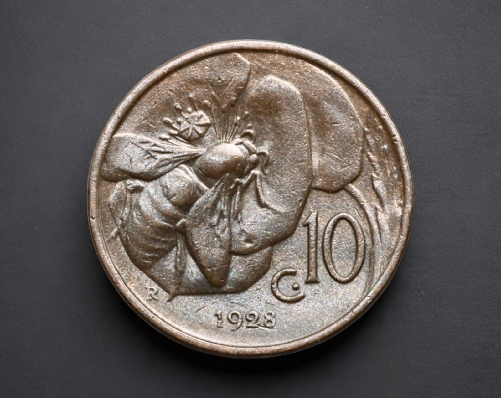 ITALY: Vittorio Emanuele III - 10 Centesimi Coin, 1928-R: A 10 Centesimi coin from the Kingdom of Italy, minted in 1928 at the Rome Mint ("R" mintmark). Struck in copper, this coin weighs 5.4g and measures 2.2cm in diameter. The obverse features a right-faci